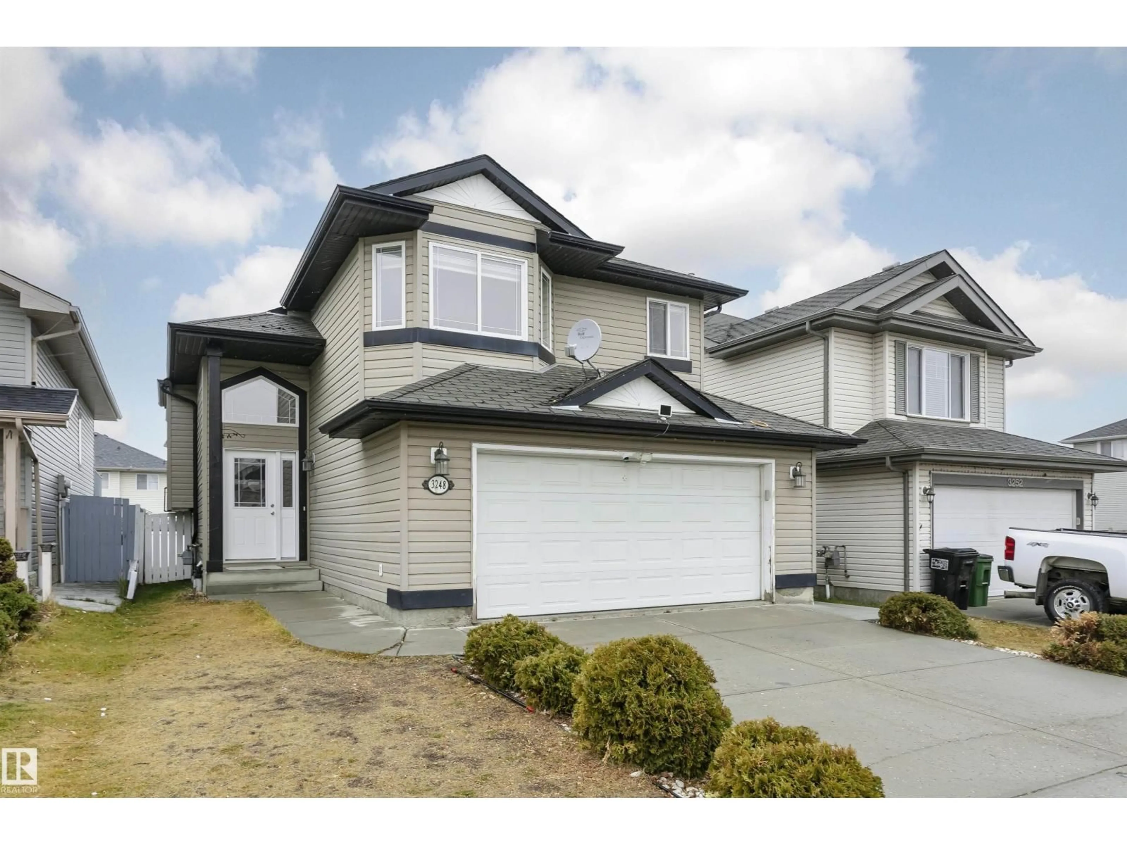 Home with vinyl exterior material, street for NW - 3248 21 ST, Edmonton Alberta T5T1G2