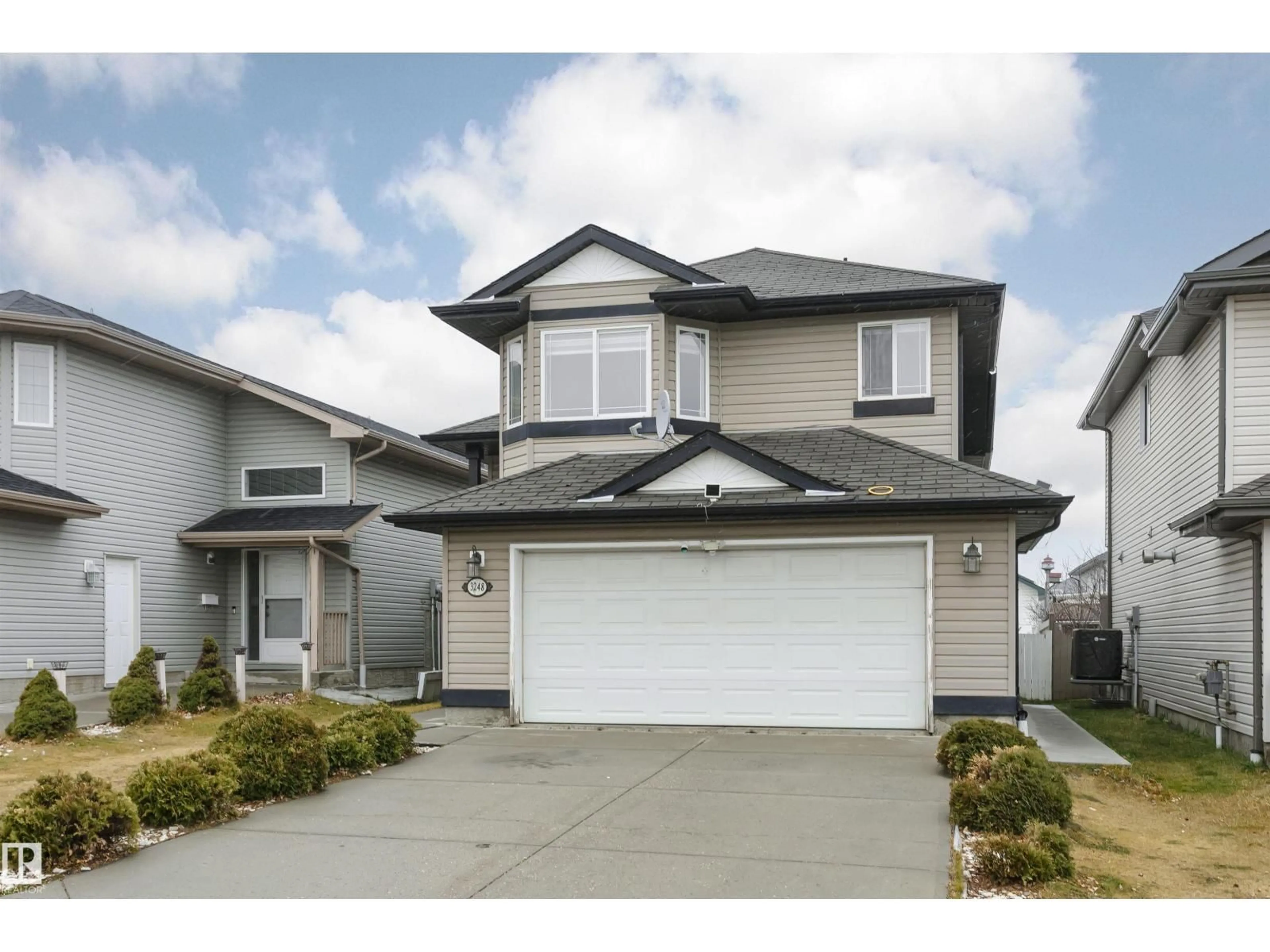 Home with vinyl exterior material, street for NW - 3248 21 ST, Edmonton Alberta T5T1G2