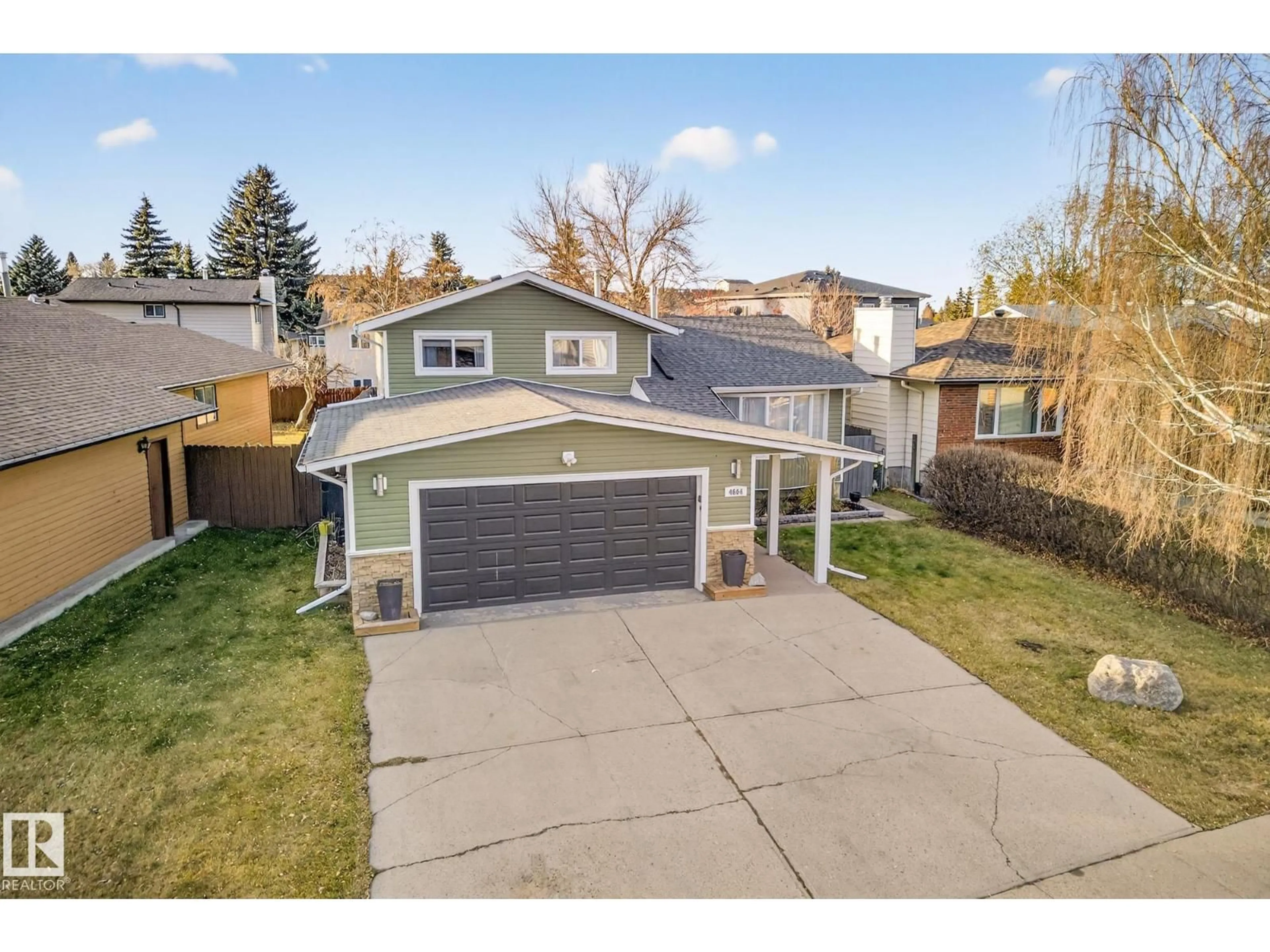 A pic from outside/outdoor area/front of a property/back of a property/a pic from drone, street for 4664 16A AV, Edmonton Alberta T6L2S2