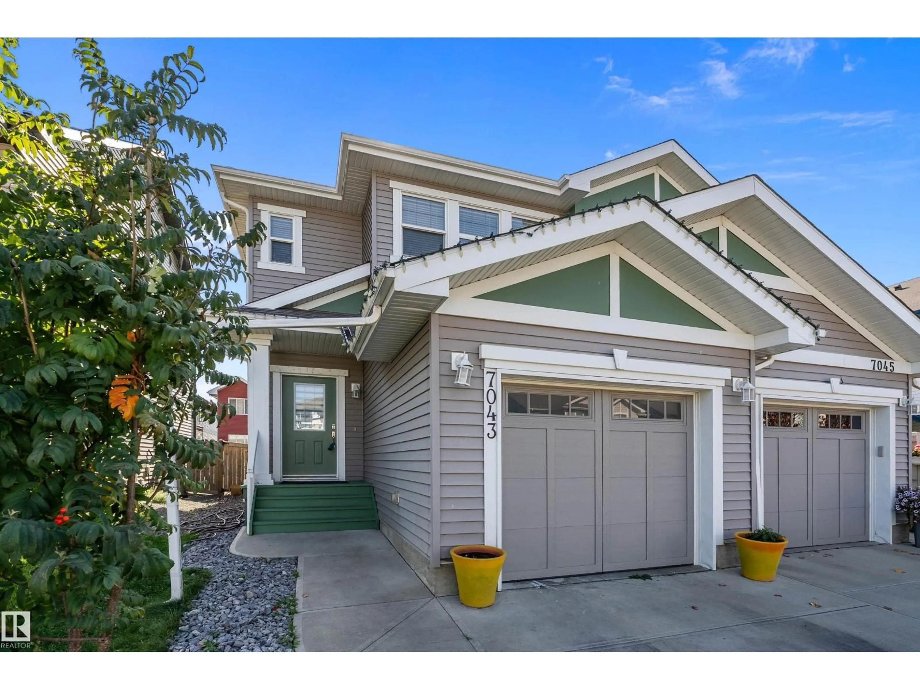 Home with vinyl exterior material, street for NW - 7043 174 AV, Edmonton Alberta T5Z0L3