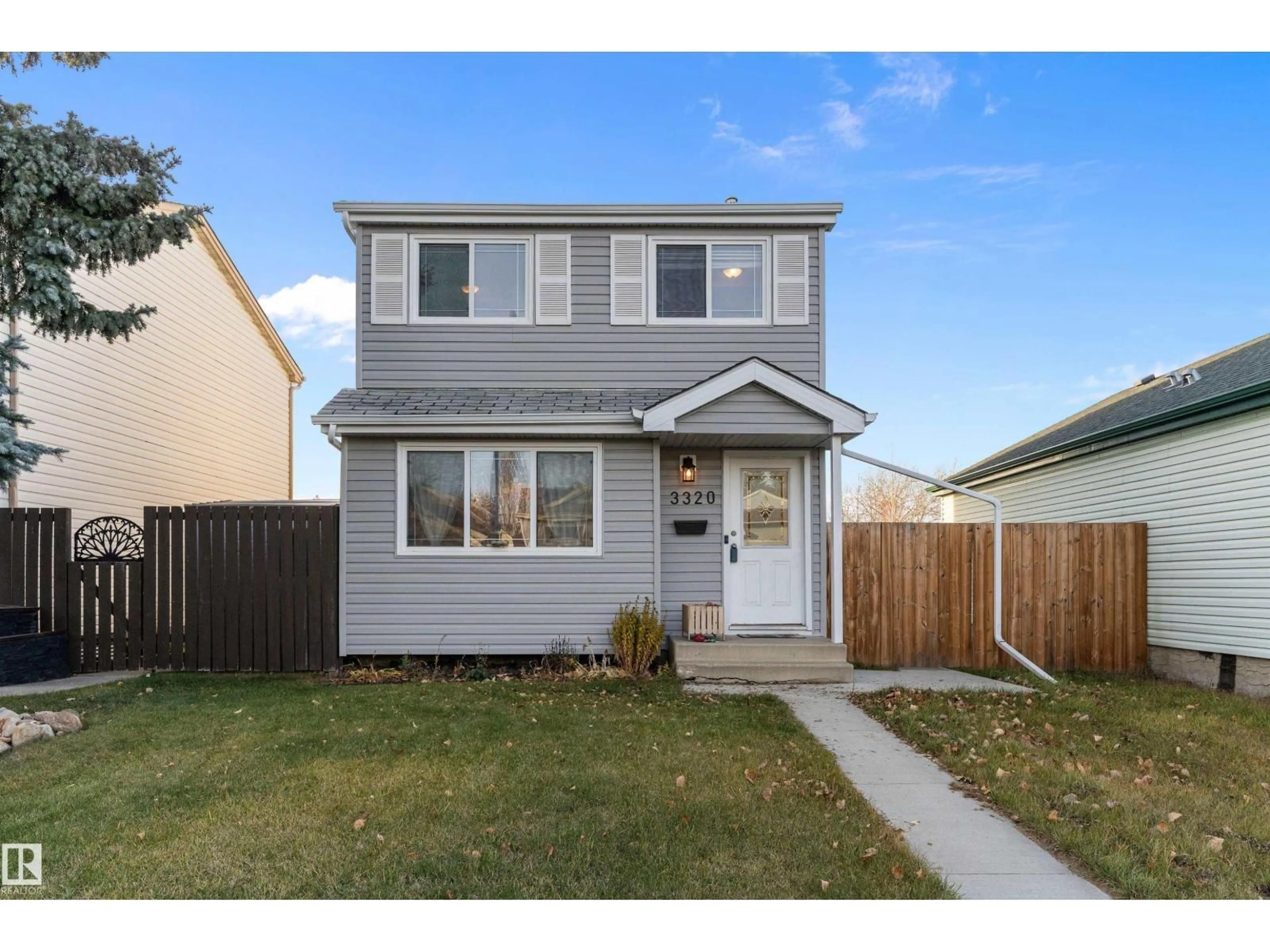 Home with vinyl exterior material, street for NW - 3320 48 ST, Edmonton Alberta T6L4J1