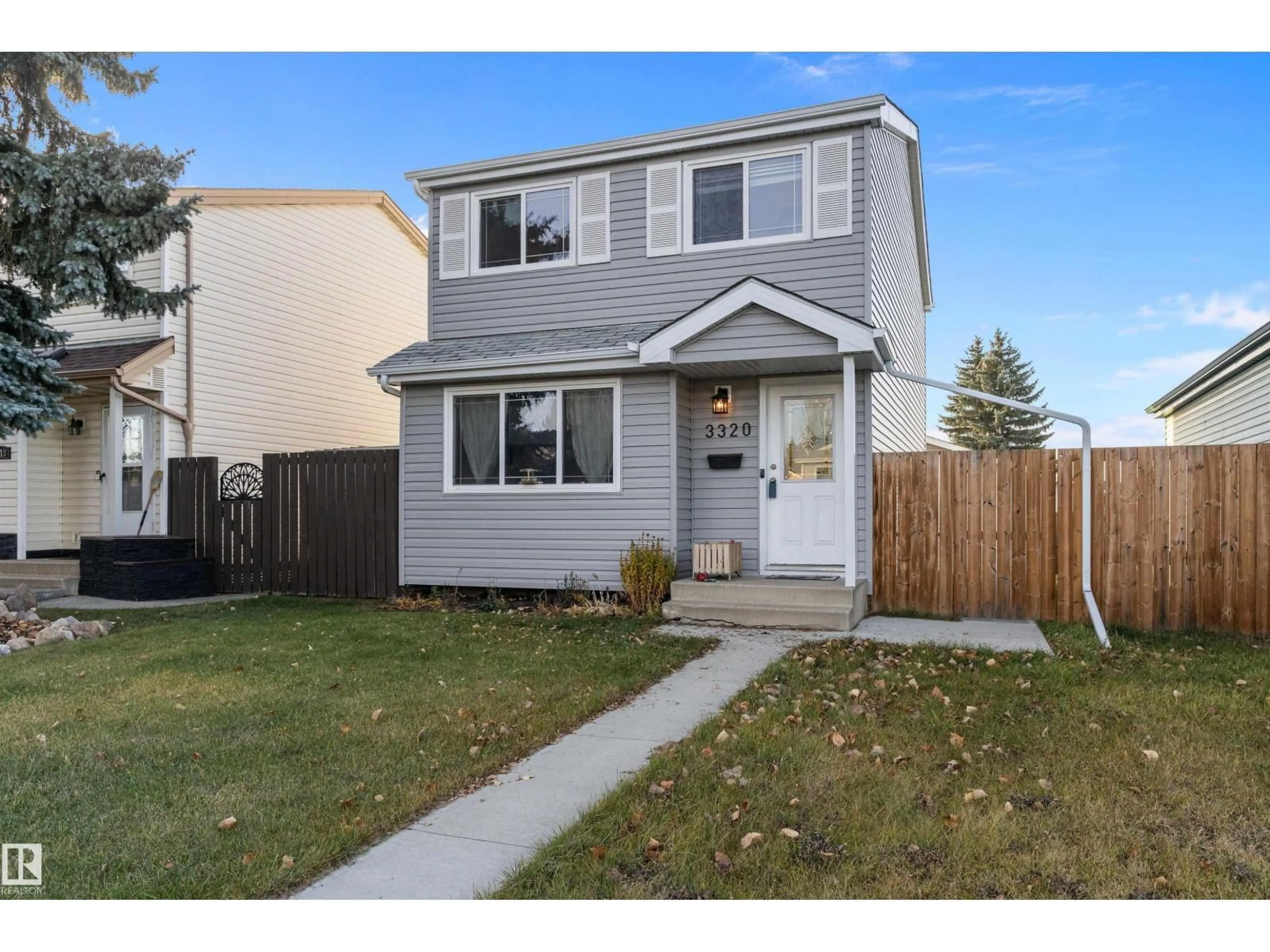 Home with vinyl exterior material, street for NW - 3320 48 ST, Edmonton Alberta T6L4J1