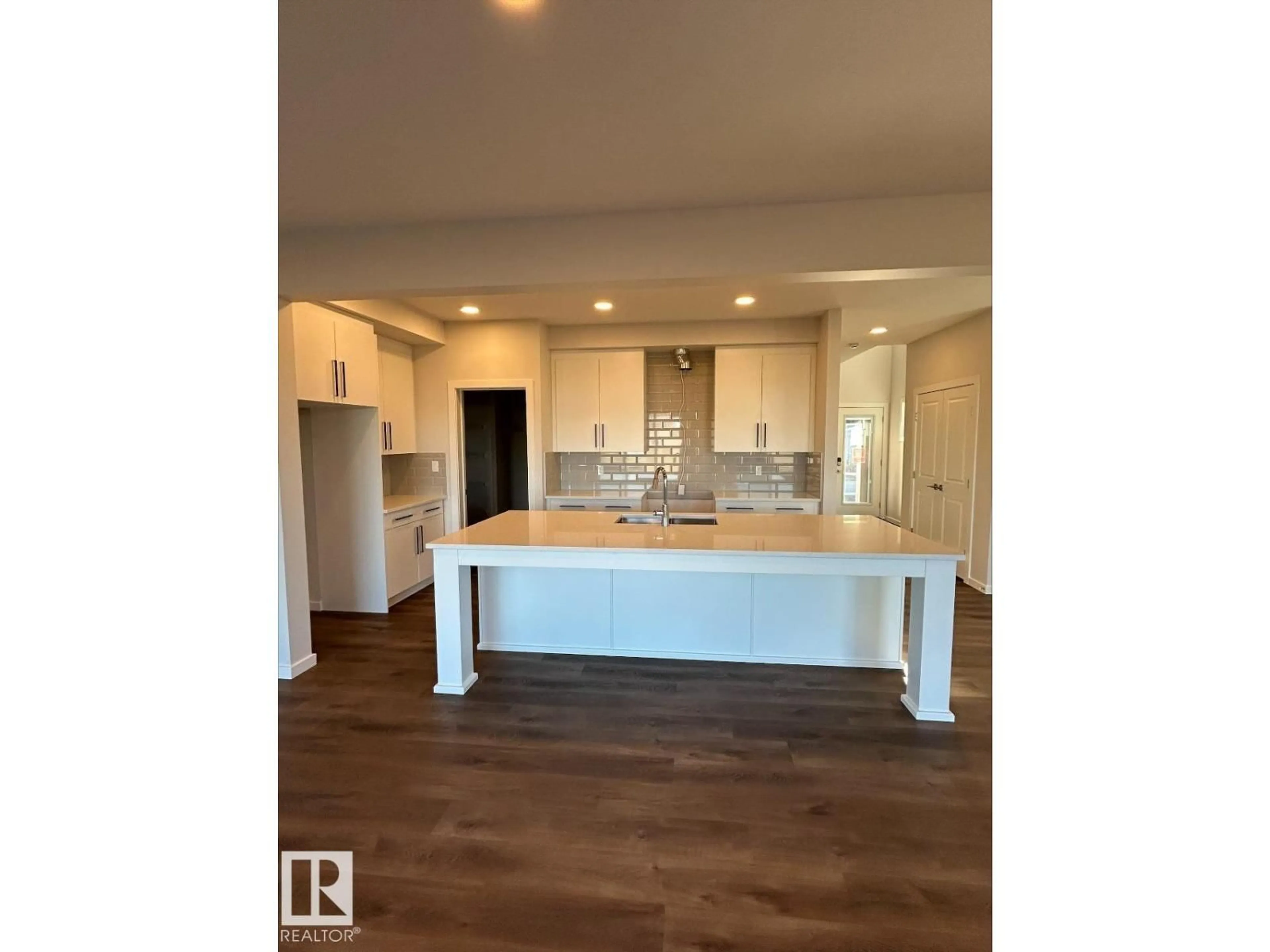 Open concept kitchen, wood/laminate floor for 328 173 AV, Edmonton Alberta T5Y4G6