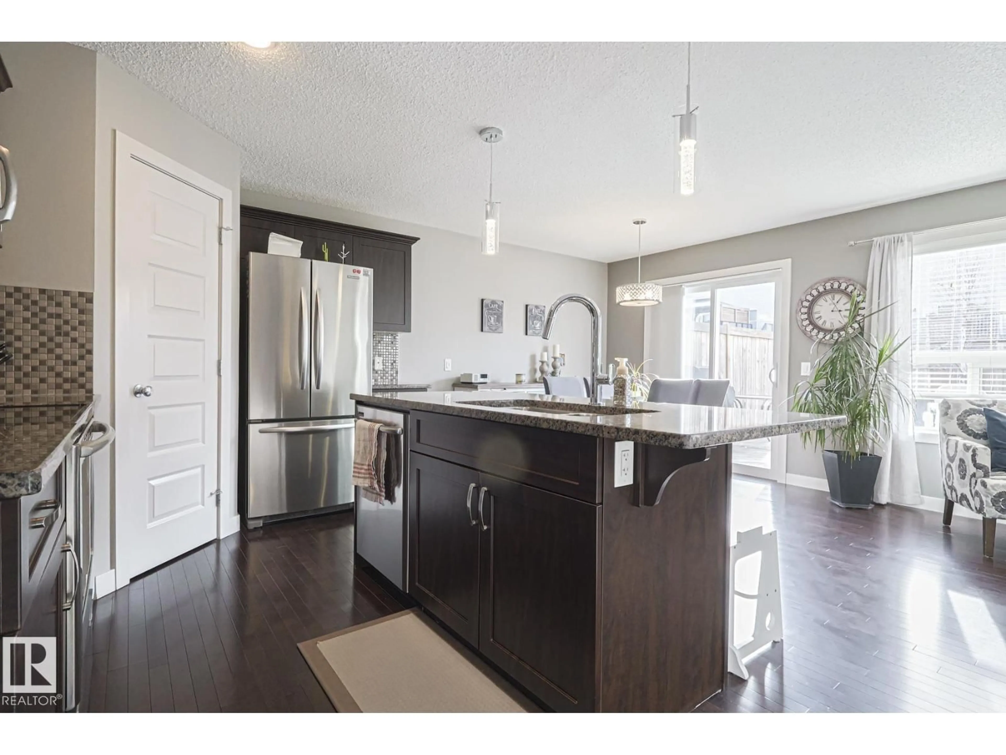 Open concept kitchen, wood/laminate floor for 177 SUMMERSTONE LN, Sherwood Park Alberta T8H0K2