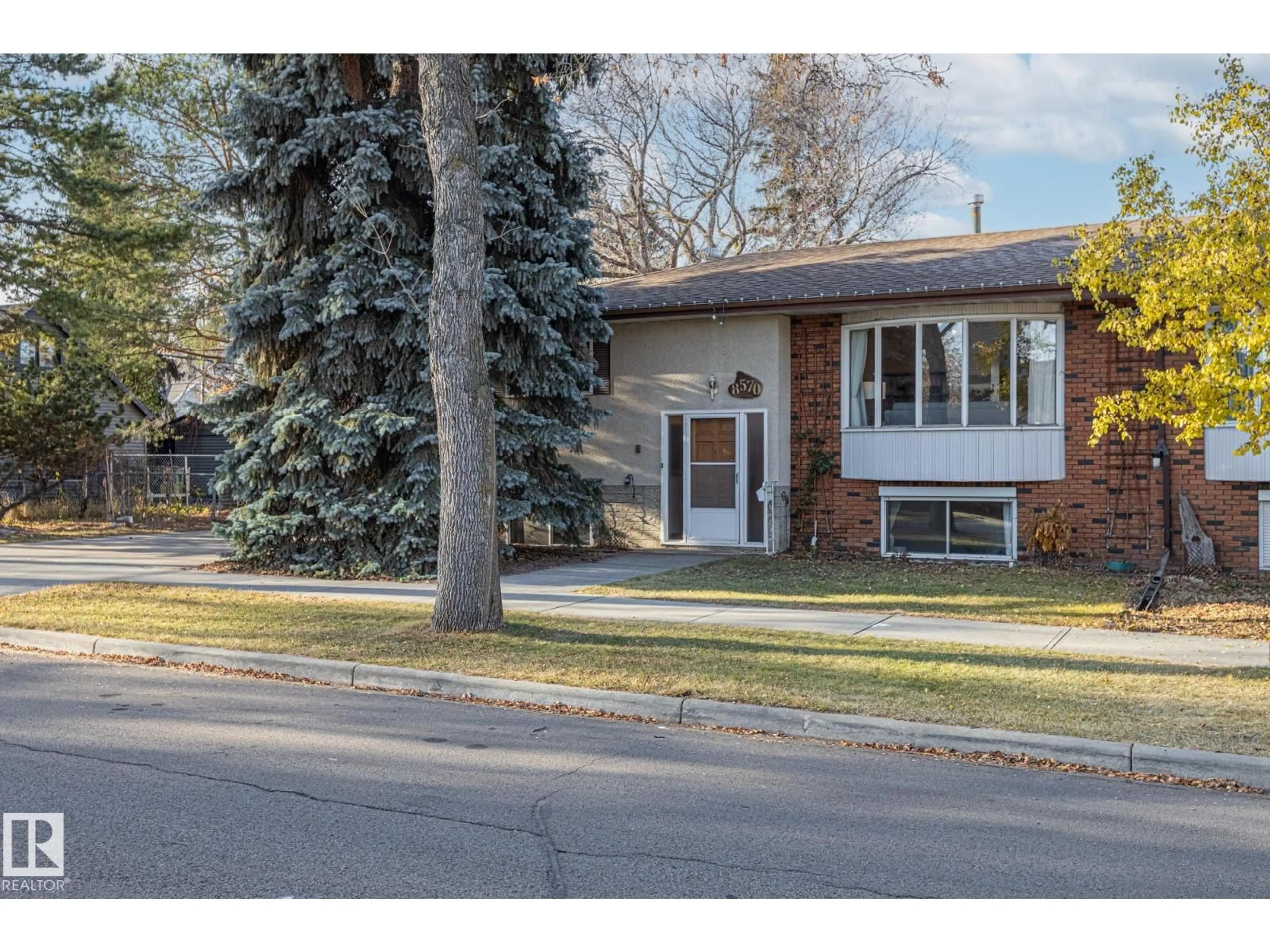 Home with brick exterior material, street for NW - 8570 89 ST, Edmonton Alberta T6C3K3