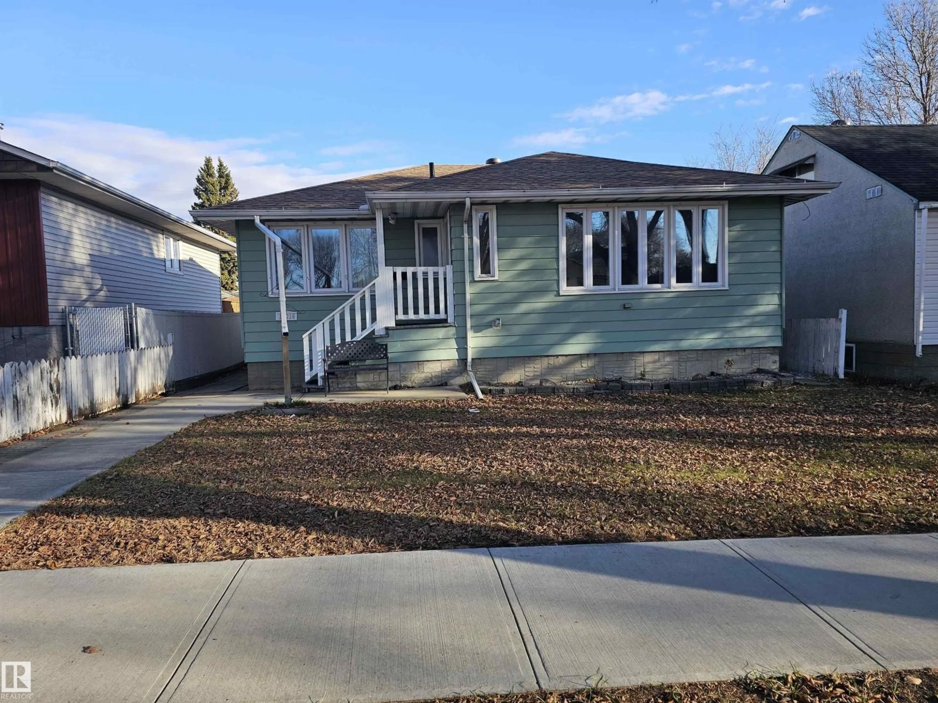 Home with vinyl exterior material, street for 12019 51 ST, Edmonton Alberta T5W3G6