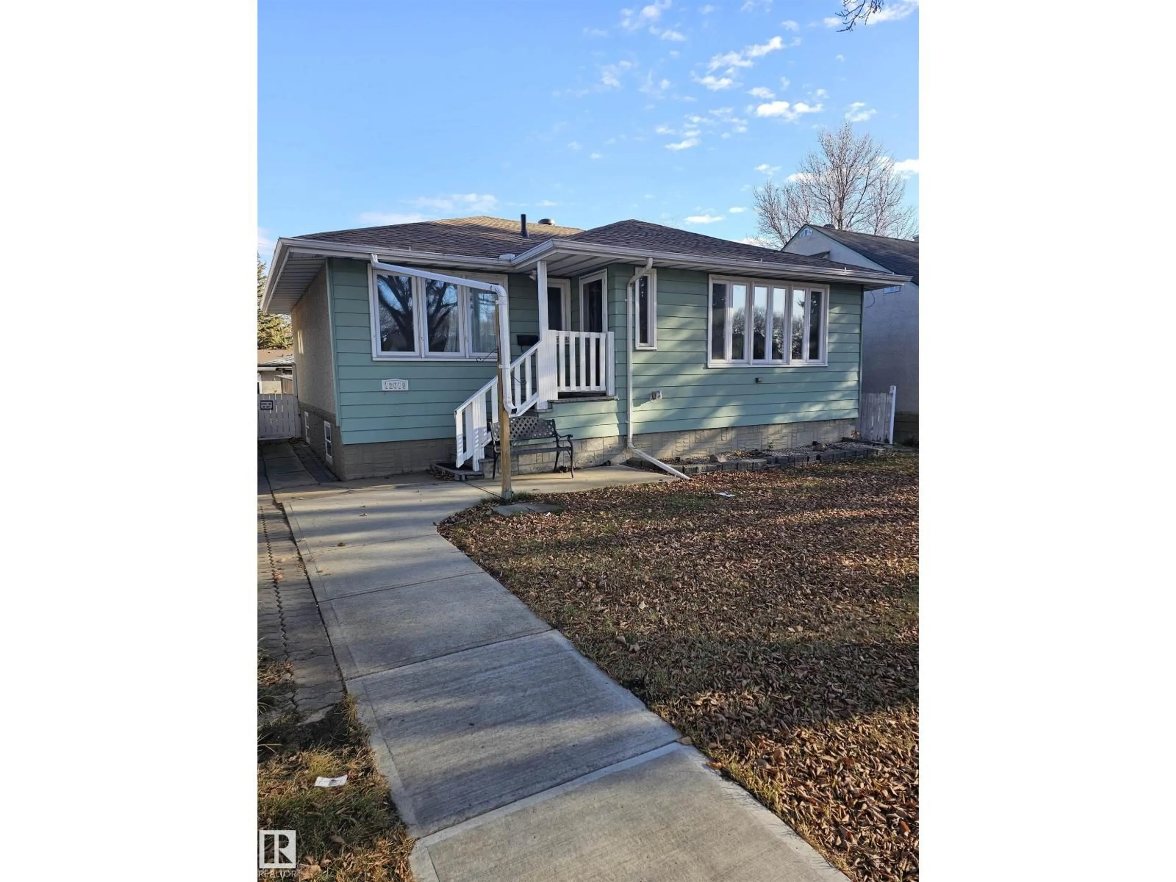 Home with vinyl exterior material, street for 12019 51 ST, Edmonton Alberta T5W3G6