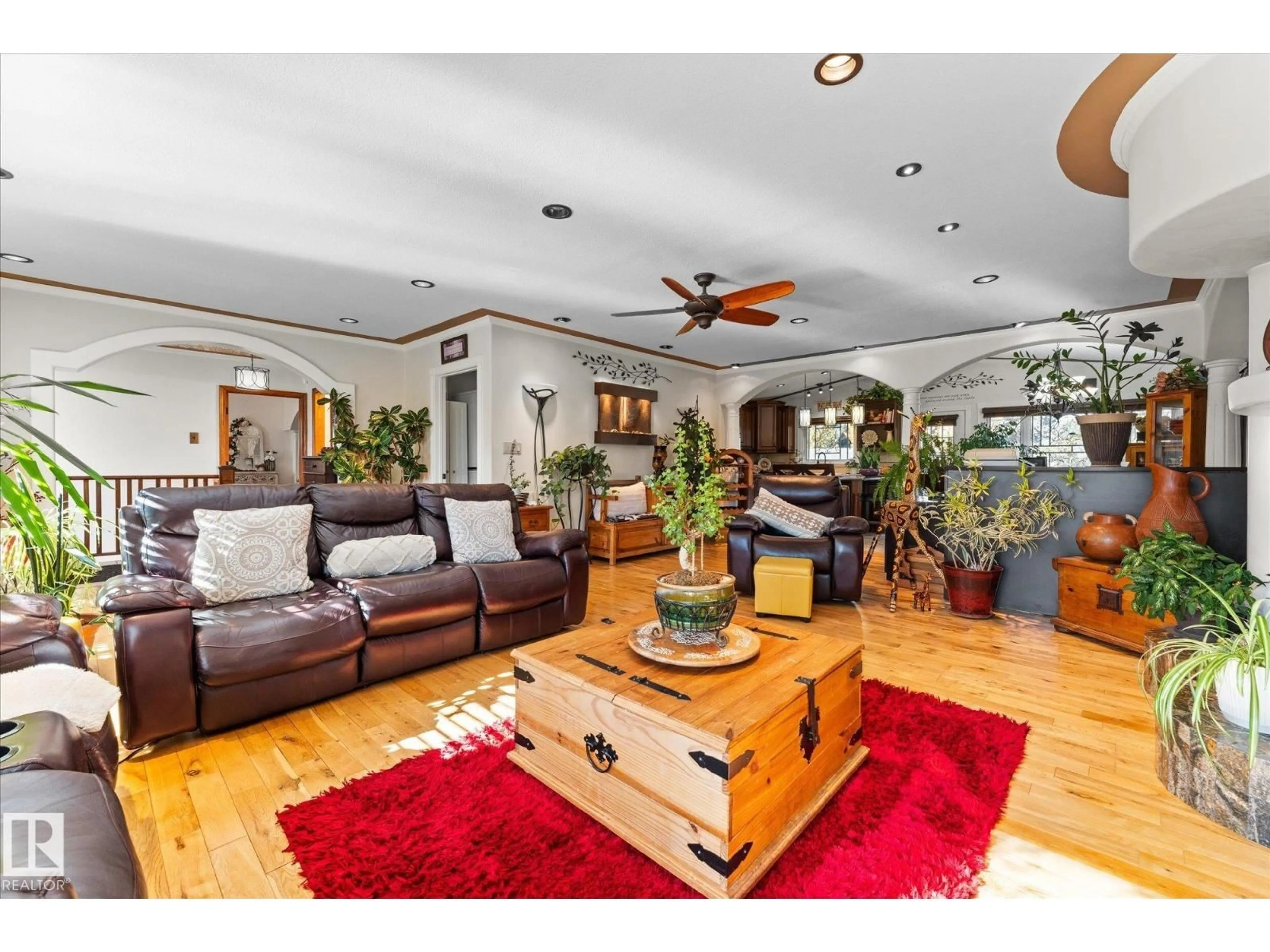 Living room with furniture, wood/laminate floor for NW - 11124 110A AV, Edmonton Alberta T5H1K1