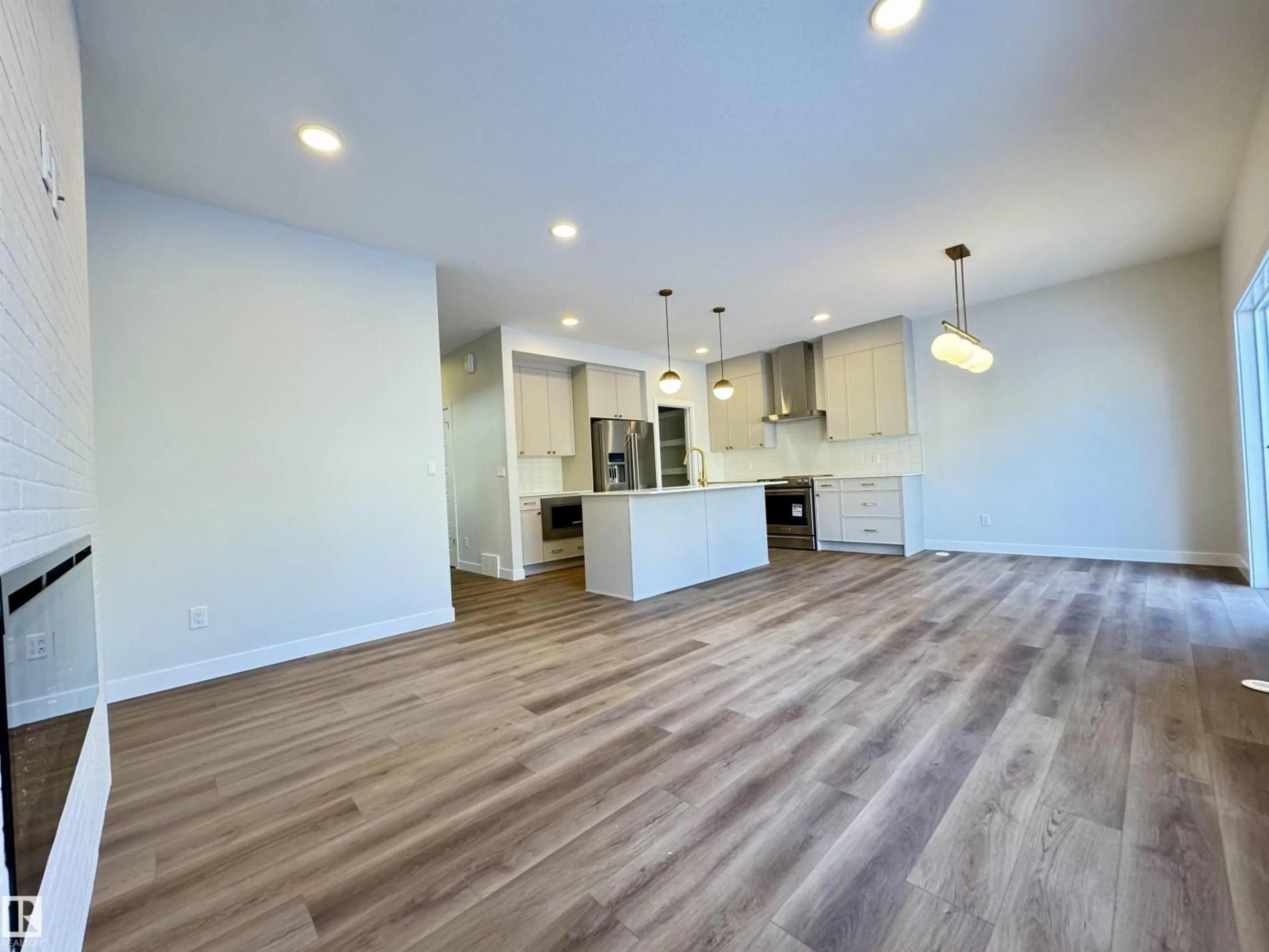 Open concept kitchen, wood/laminate floor for 3212 DIXON WY, Edmonton Alberta T6W5L3
