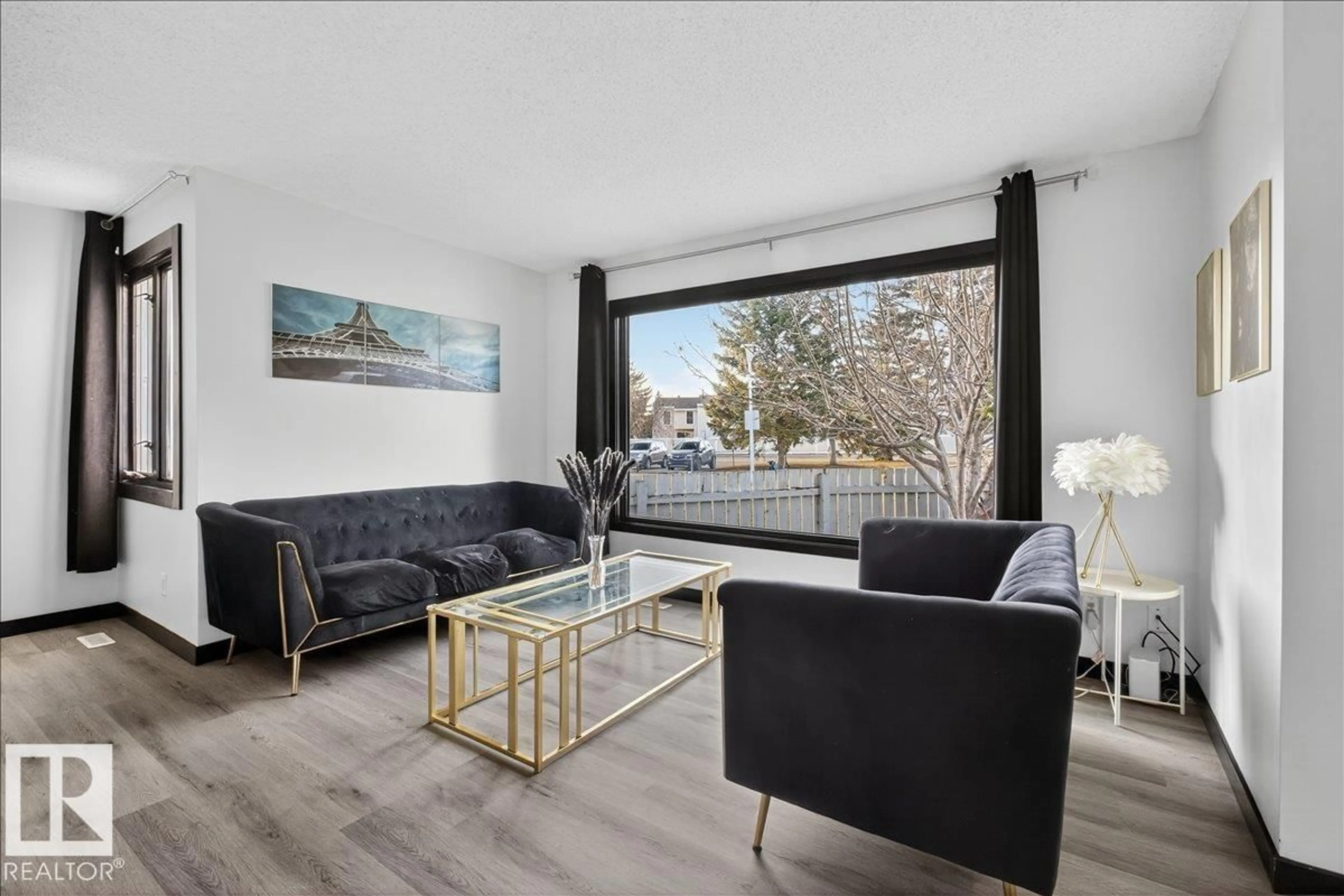 Living room with furniture, wood/laminate floor for 33 AMBERLY CO, Edmonton Alberta T5A2H9