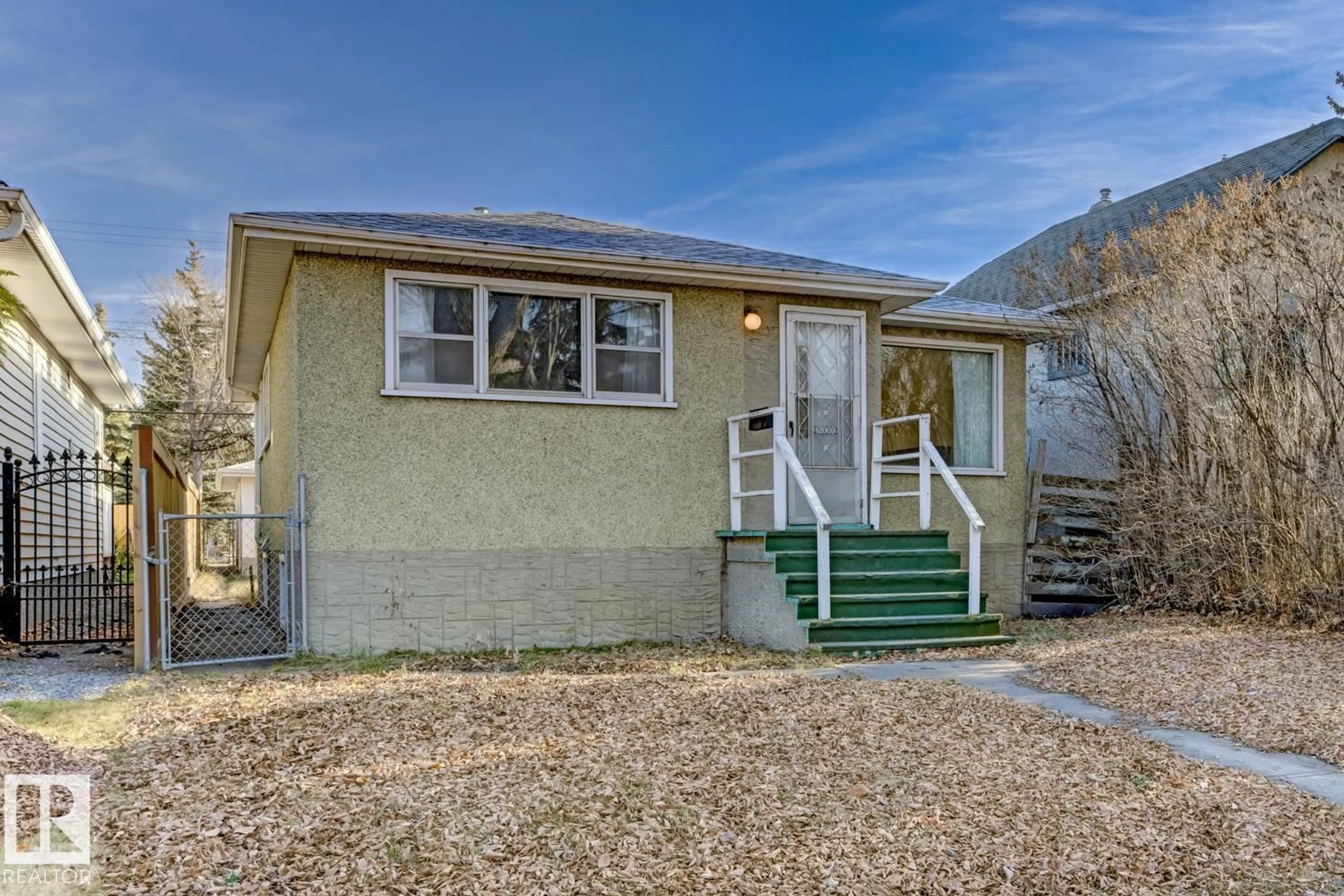 Home with vinyl exterior material, street for 12007 69 ST, Edmonton Alberta T5B1S7