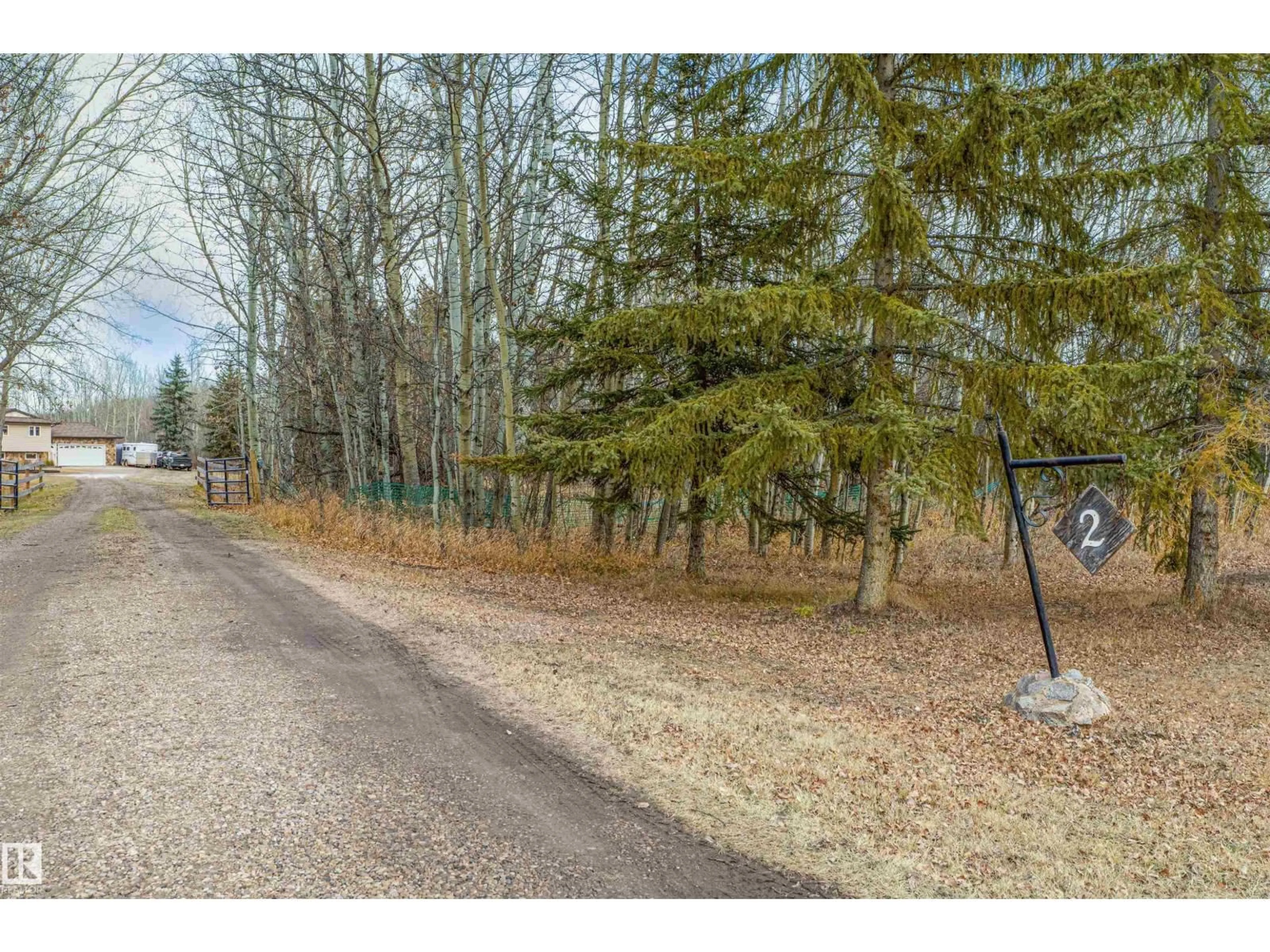 A pic from outside/outdoor area/front of a property/back of a property/a pic from drone, forest/trees view for #2 - 52510 RGE ROAD 213, Rural Strathcona County Alberta T8G2E6