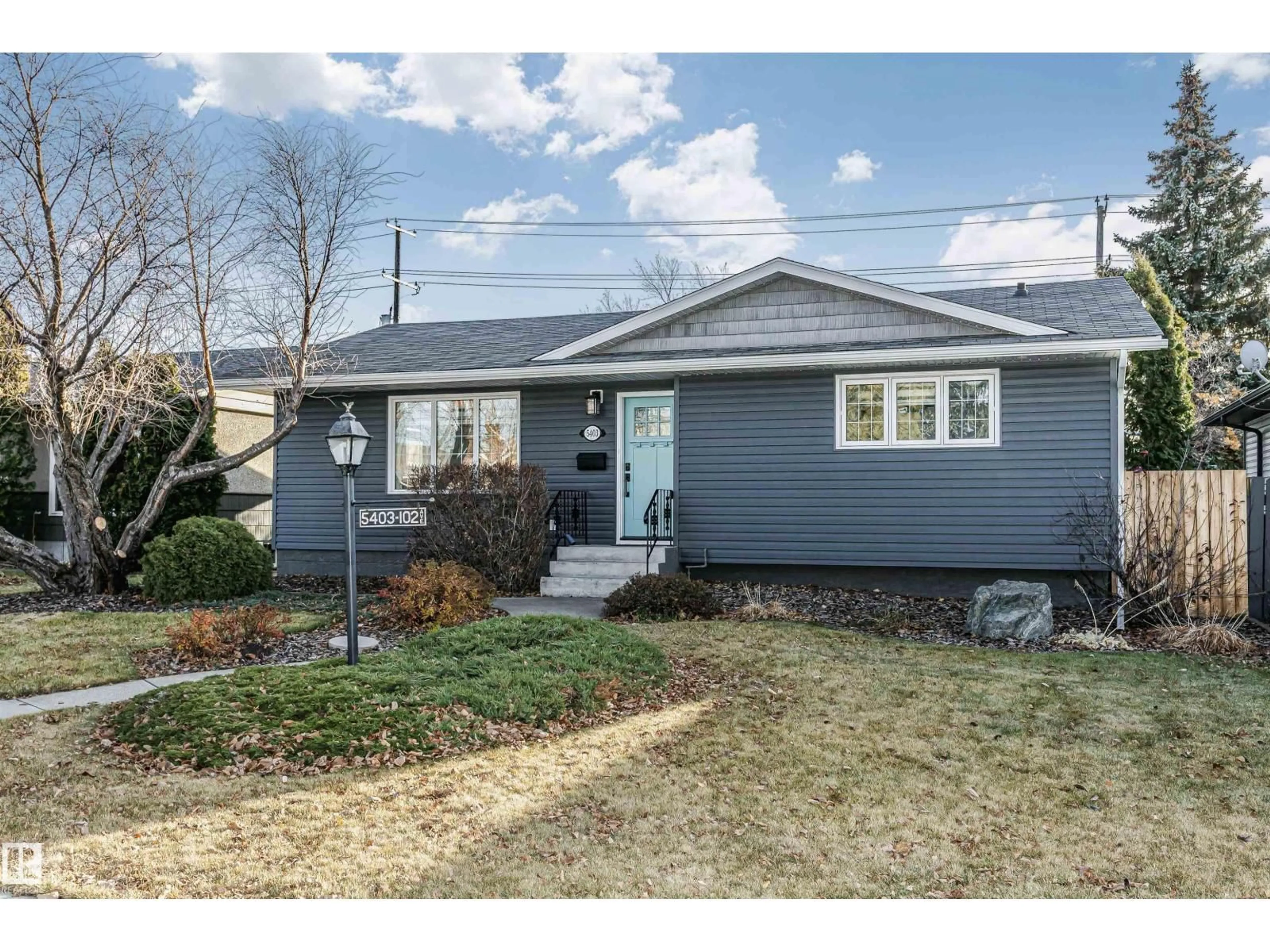 Home with vinyl exterior material, street for 5403 102 AV, Edmonton Alberta T6A0N1