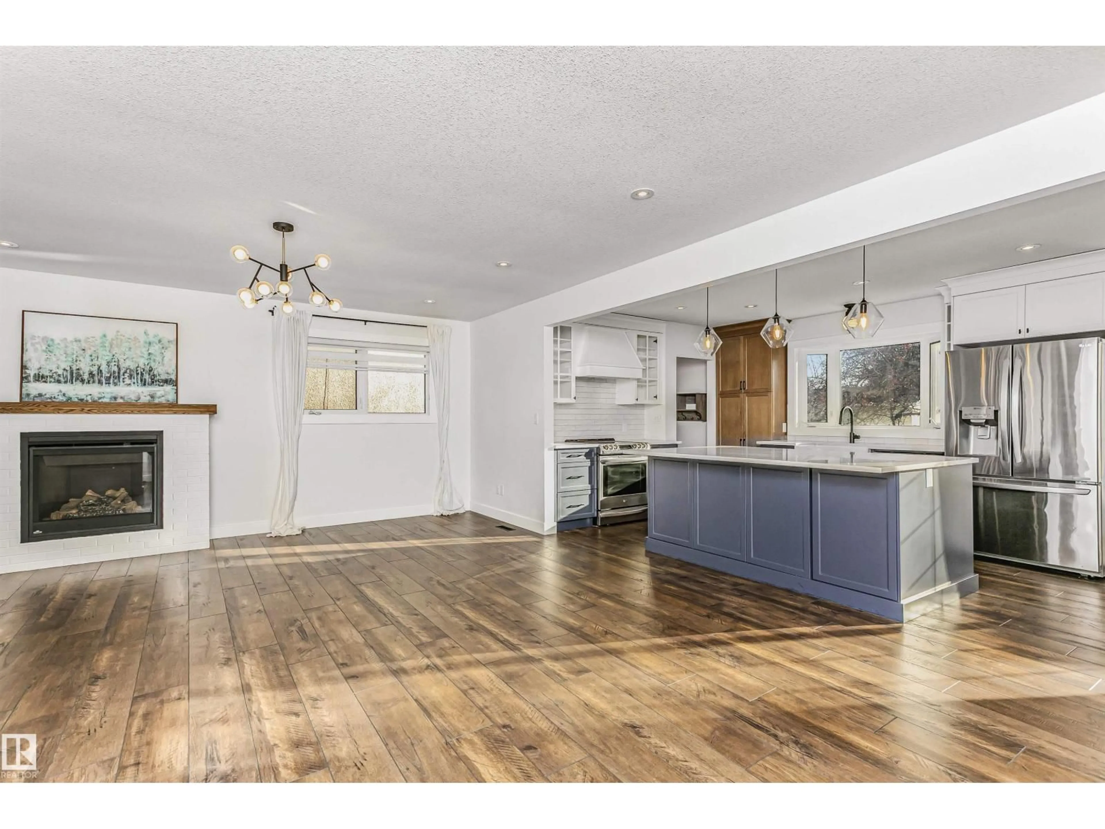 Open concept kitchen, wood/laminate floor for 5403 102 AV, Edmonton Alberta T6A0N1