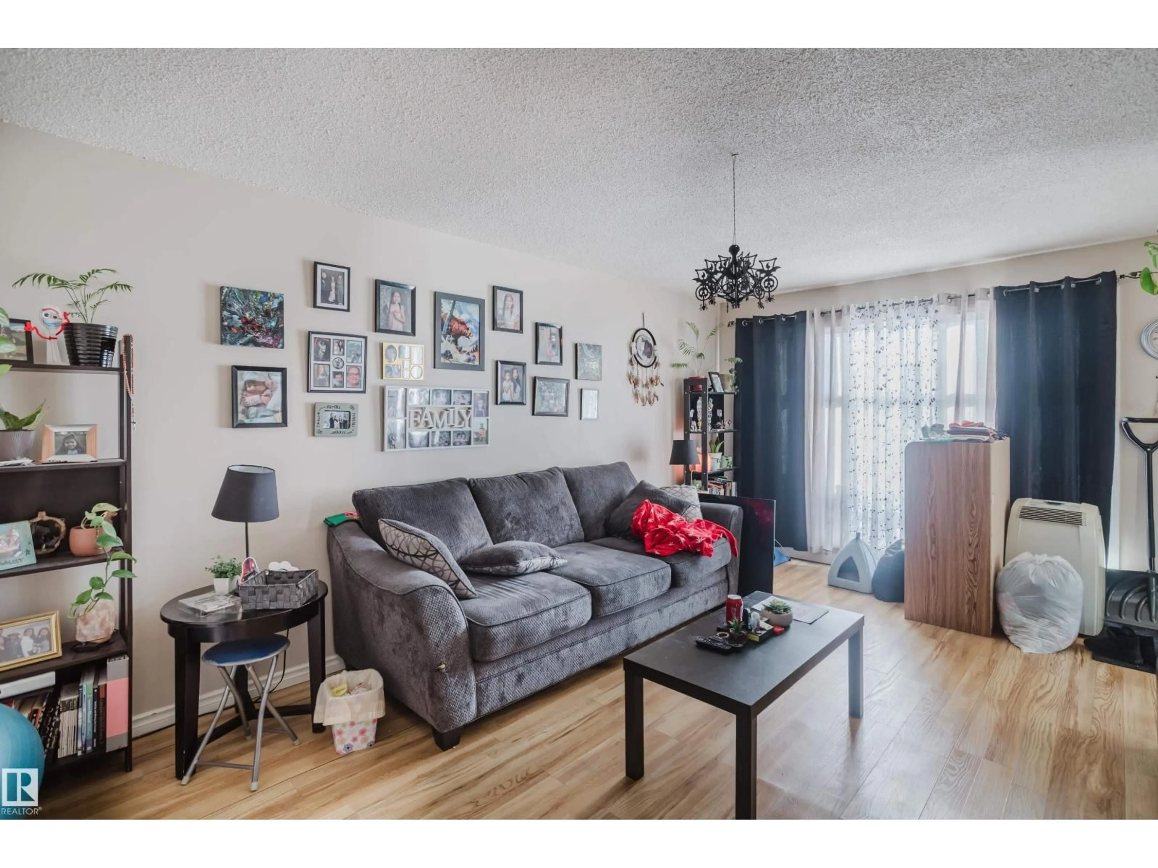 Living room with furniture, wood/laminate floor for 5829 52 ST, Wetaskiwin Alberta T9A2W5