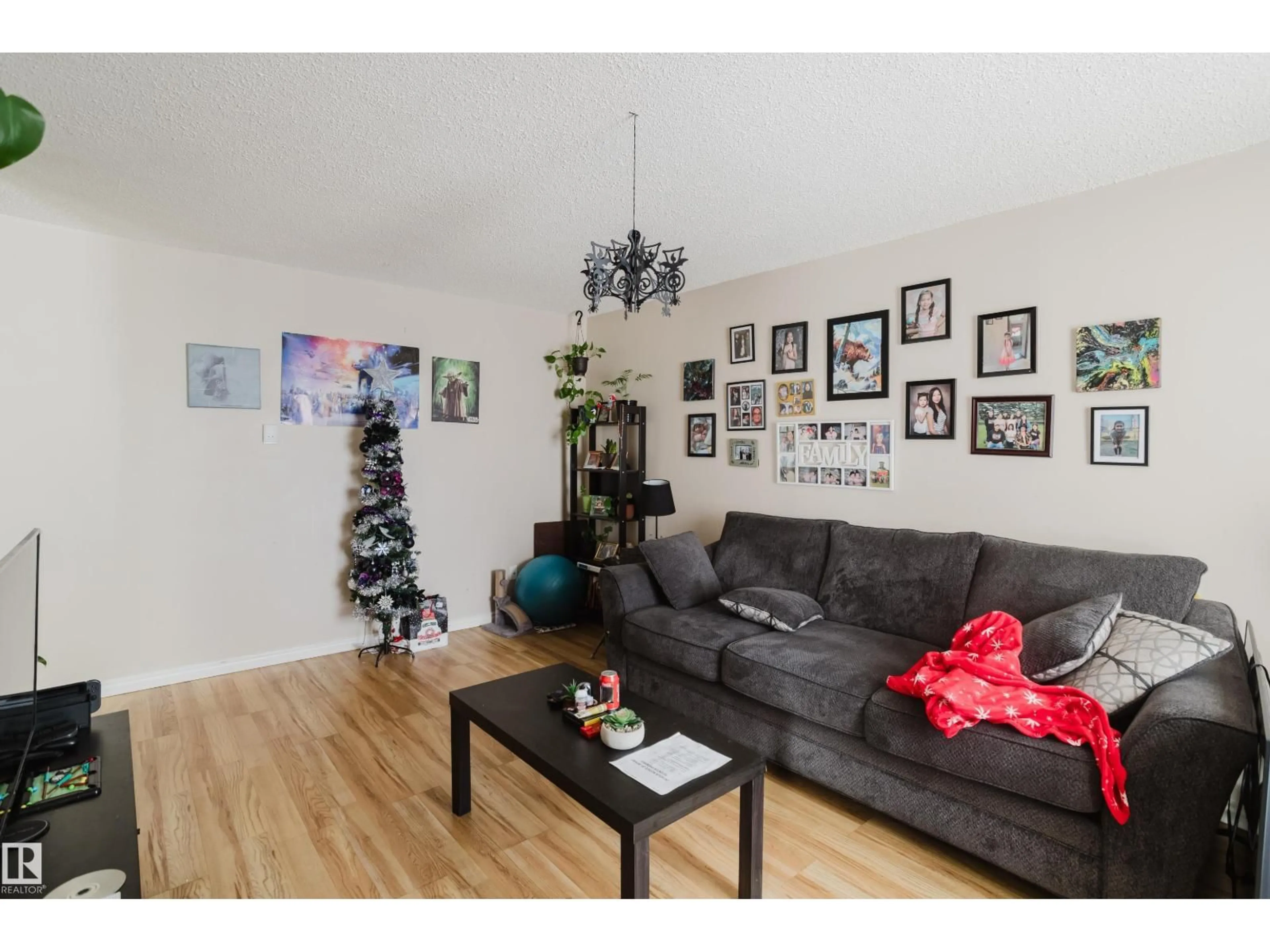 Living room with furniture, wood/laminate floor for 5829 52 ST, Wetaskiwin Alberta T9A2W5