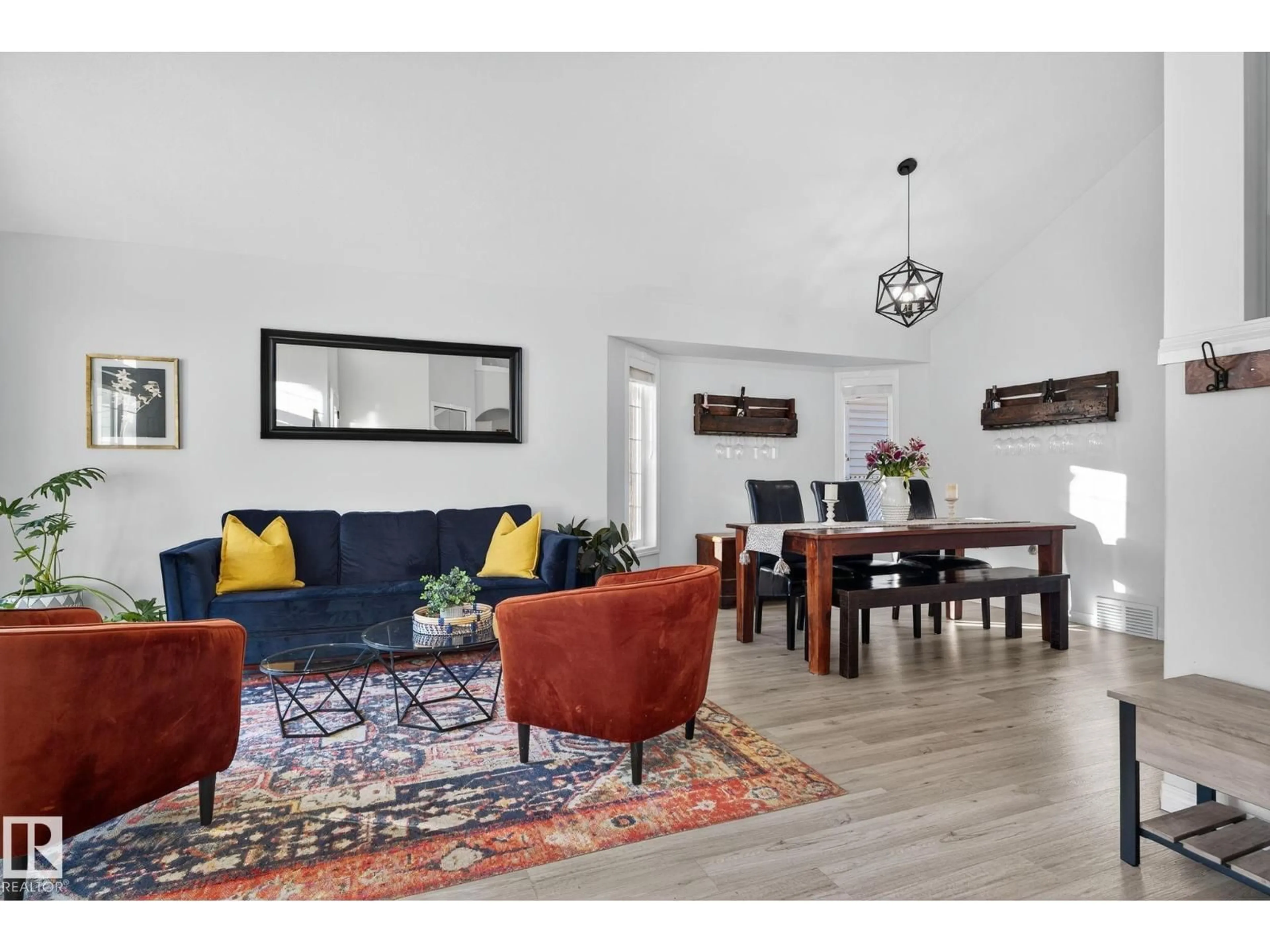 Living room with furniture, wood/laminate floor for 7224 158 AV, Edmonton Alberta T5Z2Z6