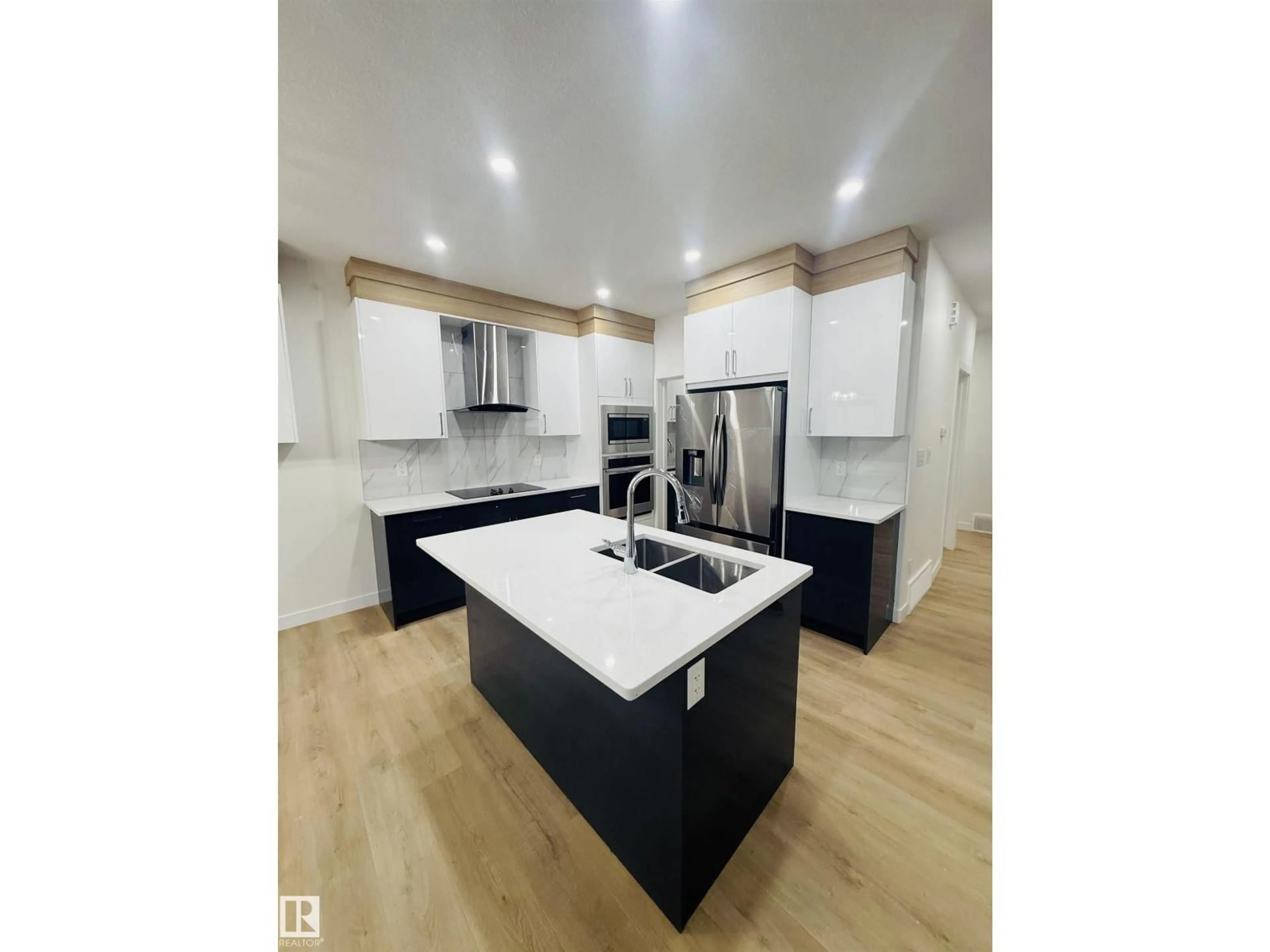 Open concept kitchen, wood/laminate floor for 4007 36 ST, Beaumont Alberta T4X3H3