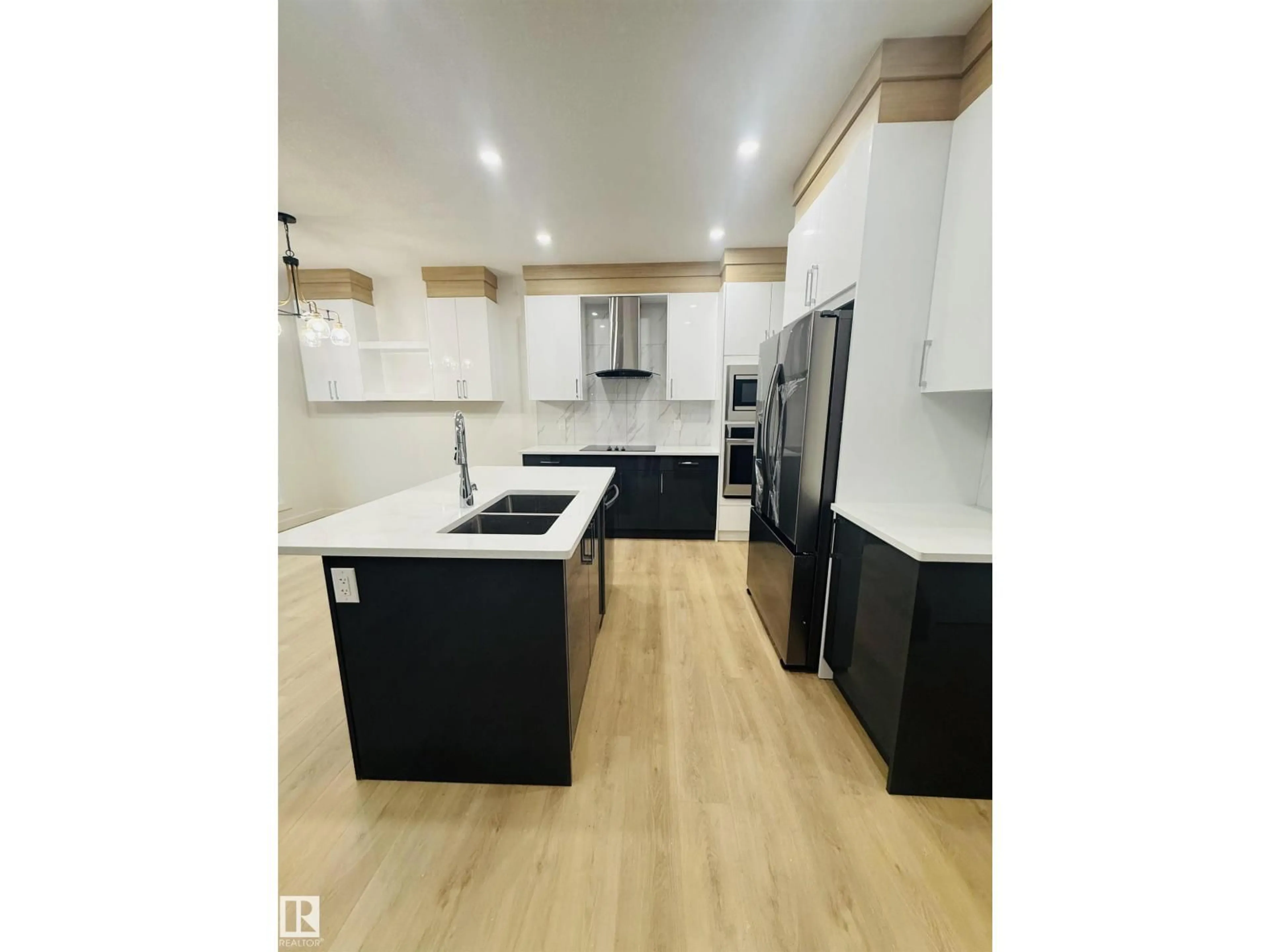 Open concept kitchen, wood/laminate floor for 4007 36 ST, Beaumont Alberta T4X3H3