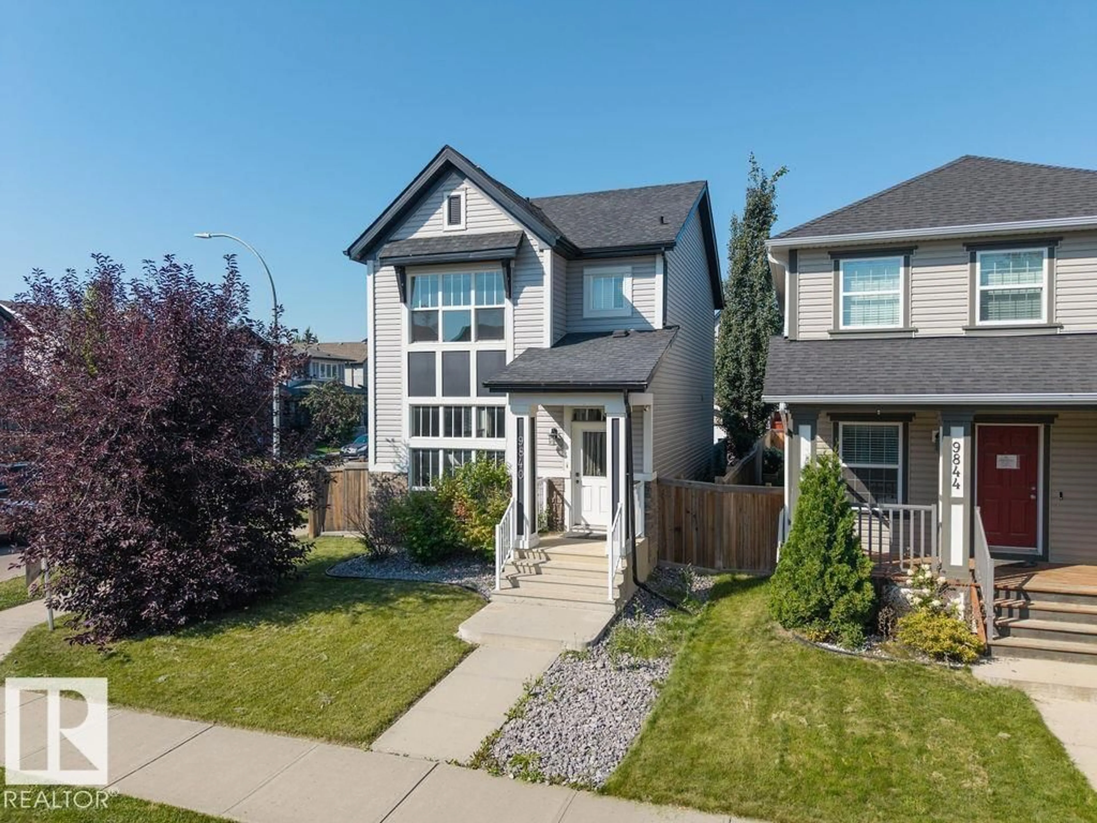 Home with vinyl exterior material, street for 9840 220 ST, Edmonton Alberta T5T4M3