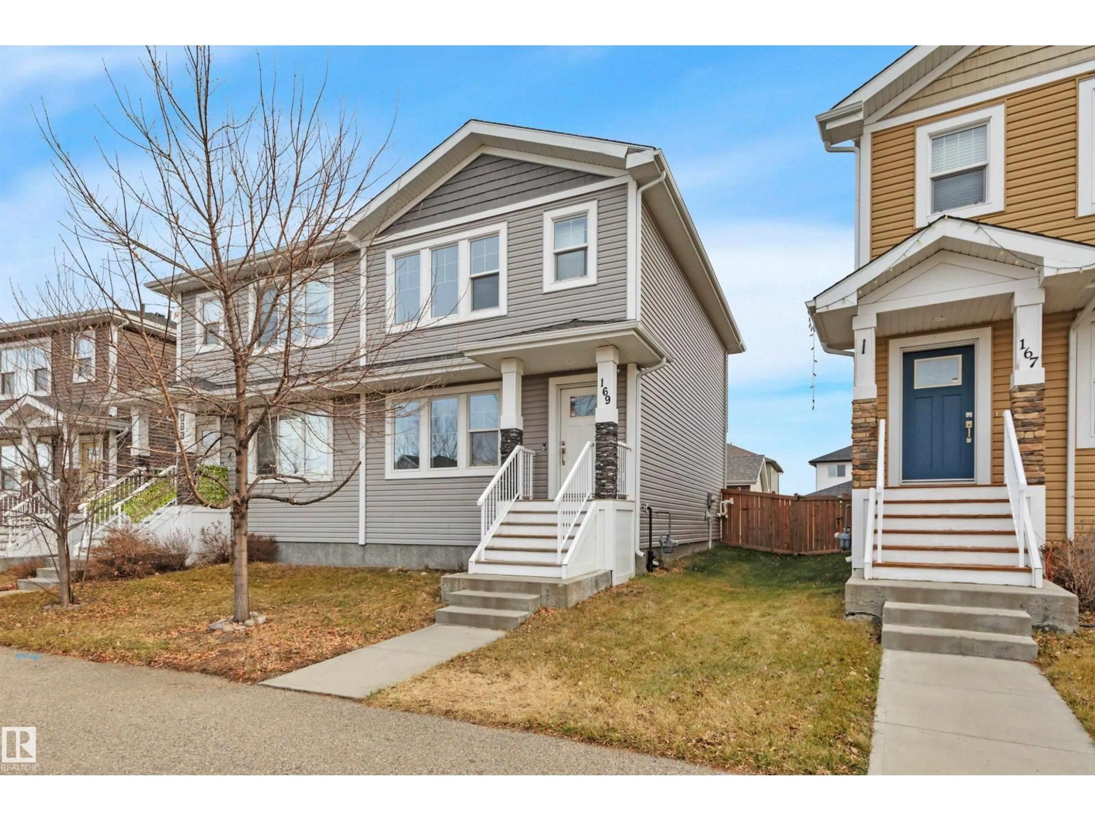 Home with vinyl exterior material, street for 169 ROBINSON DR, Leduc Alberta T9E1G5