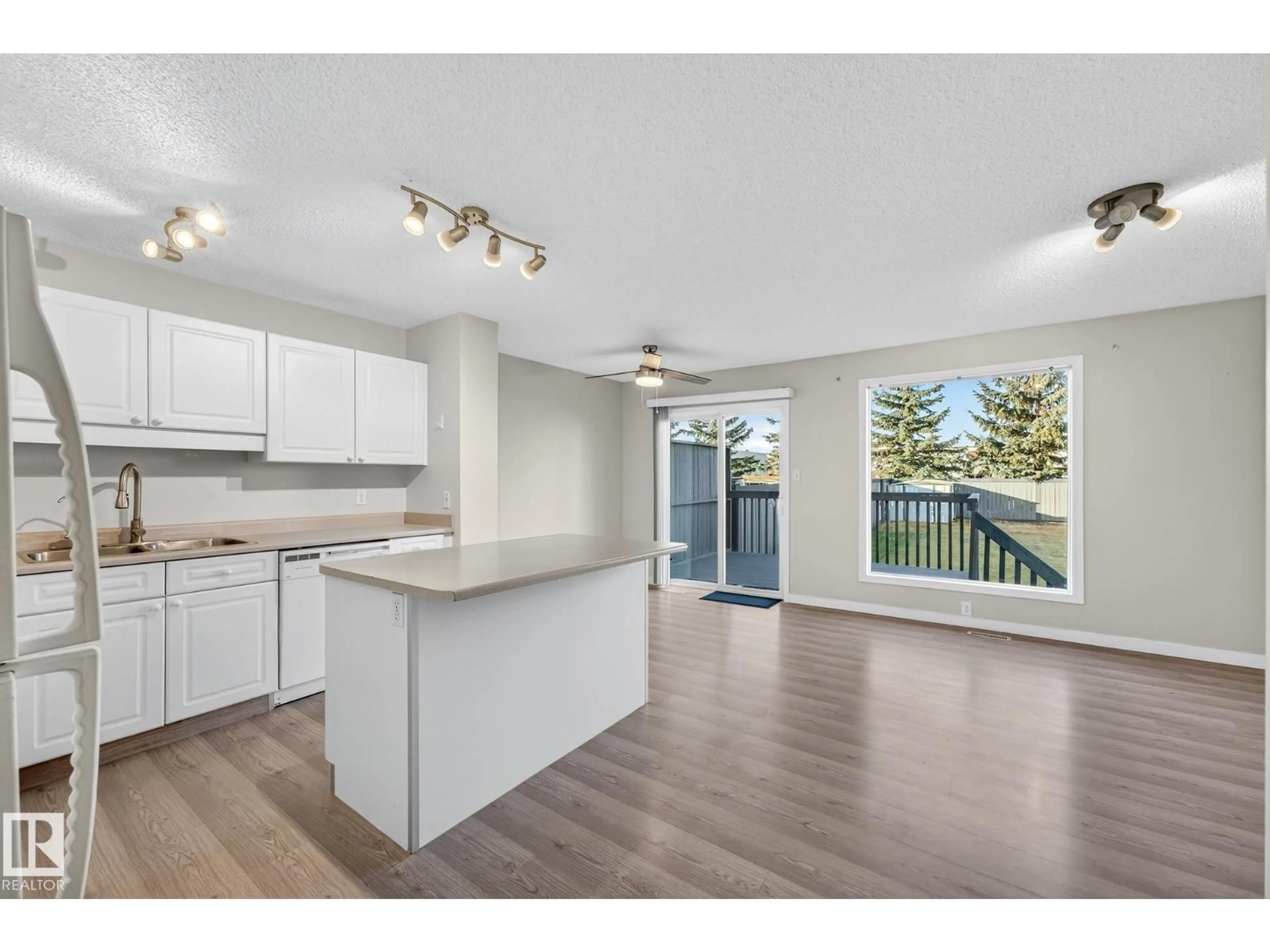Open concept kitchen, wood/laminate floor for 1094 BARNES WY, Edmonton Alberta T6W1E5