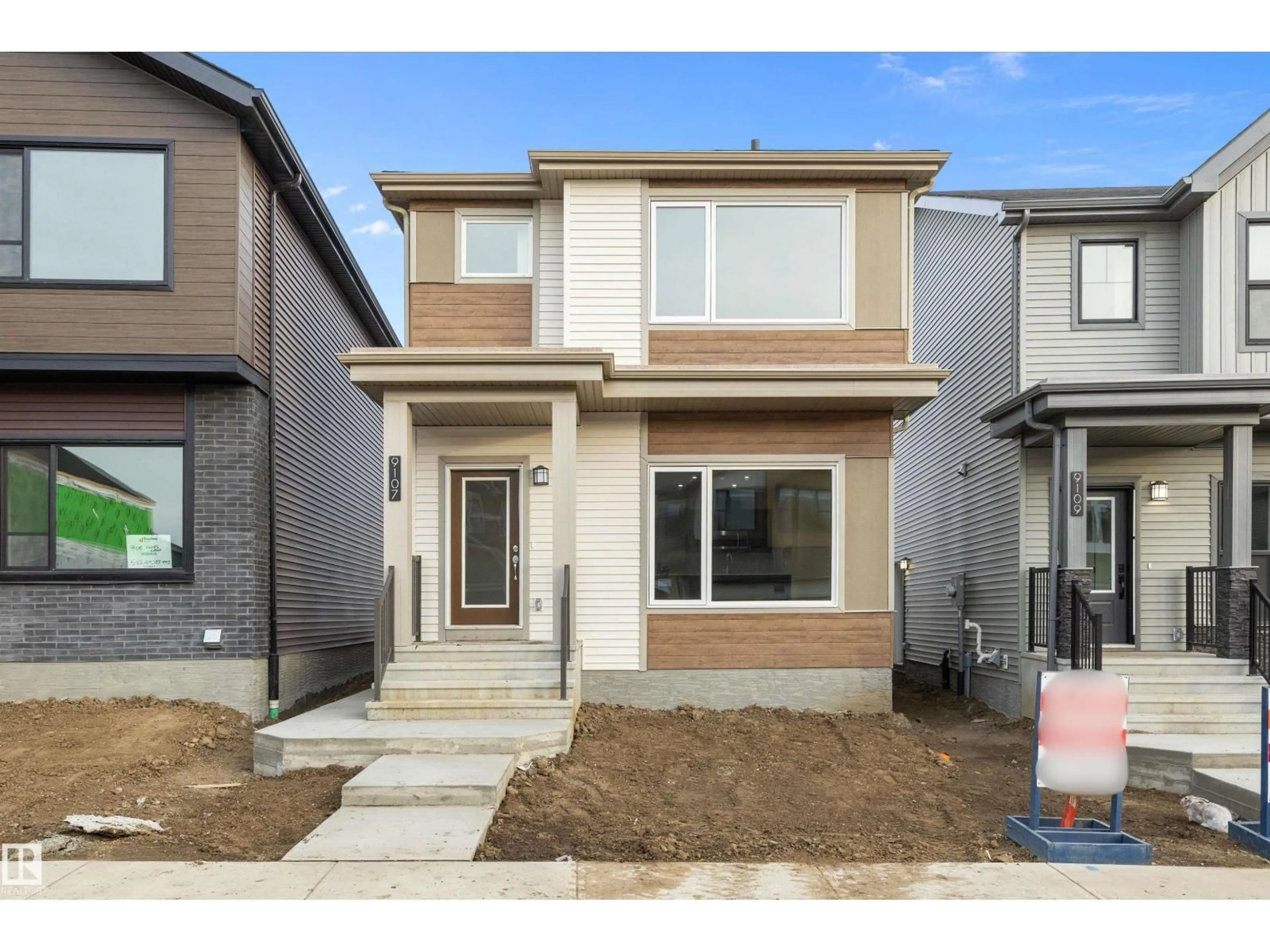 Home with vinyl exterior material, street for 9107 ELVES LOOP NW, Edmonton Alberta T6M3G2