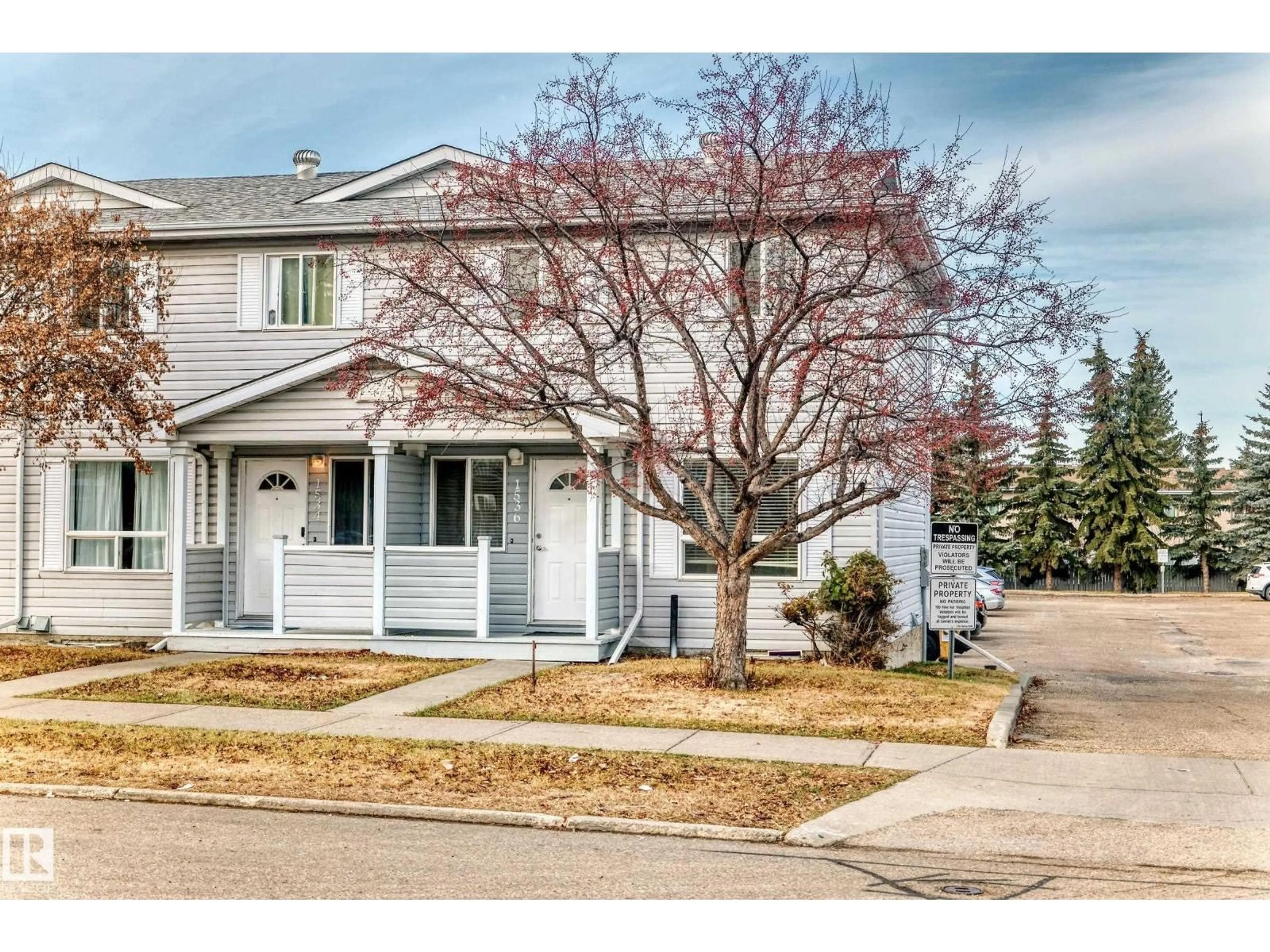 Home with vinyl exterior material, street for 1536 MILLWOODS RD E NW, Edmonton Alberta T6V6V5