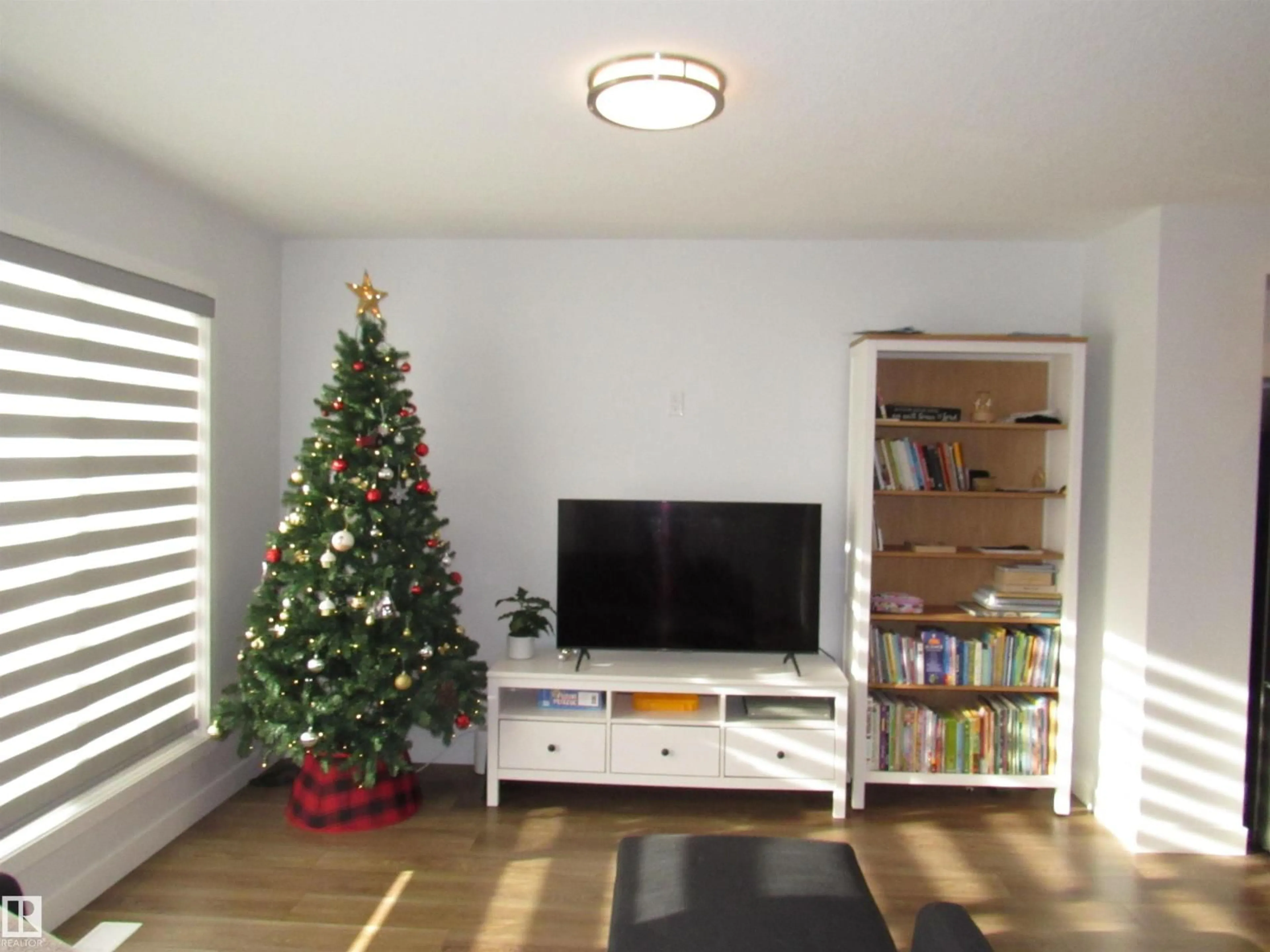 Living room with furniture, wood/laminate floor for 201 SUNLAND WY, Sherwood Park Alberta T8H2Y6