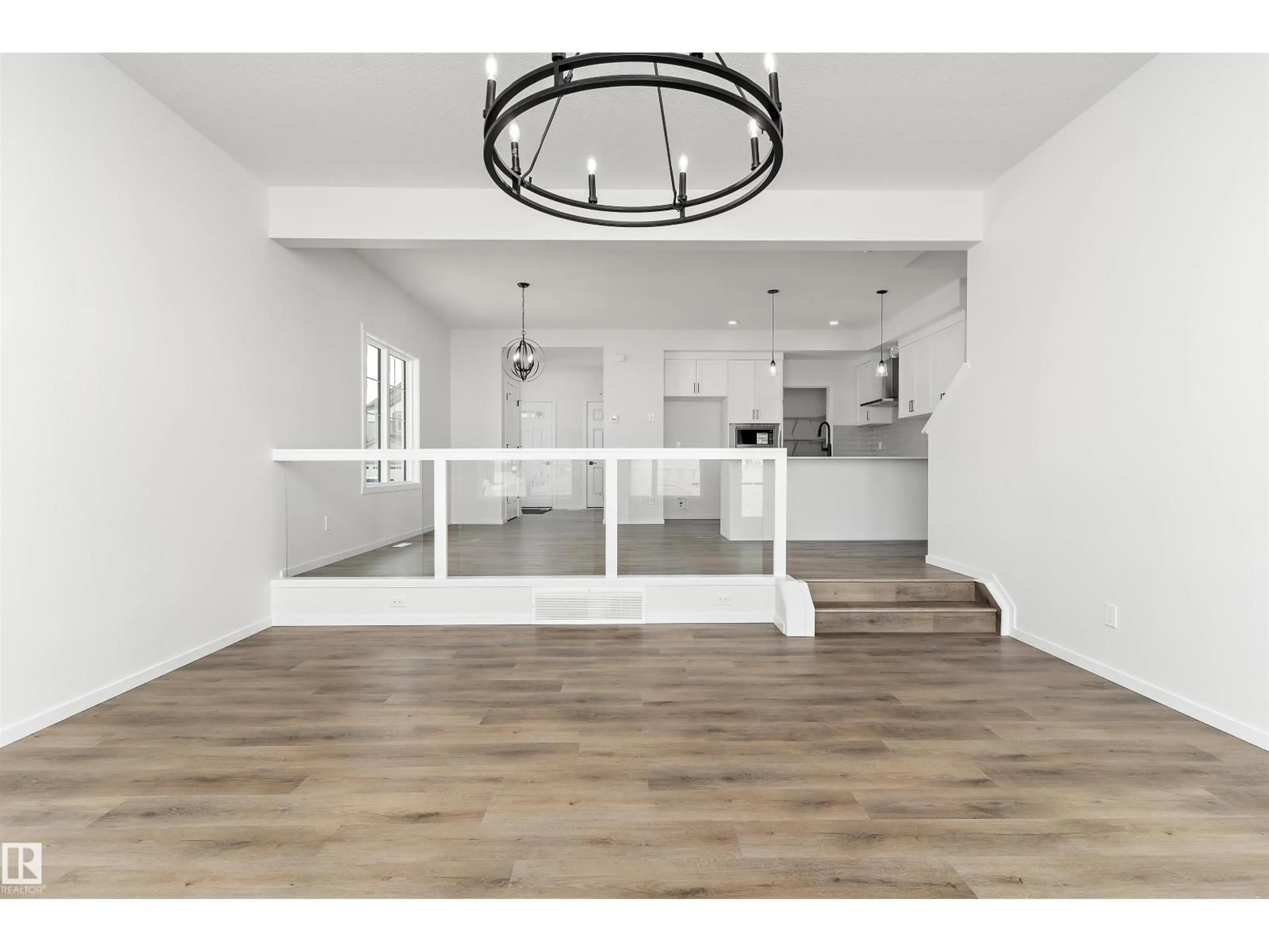 Open concept kitchen, wood/laminate floor for 2382 MUCKLEPLUM WAY, Edmonton Alberta T6X3K1