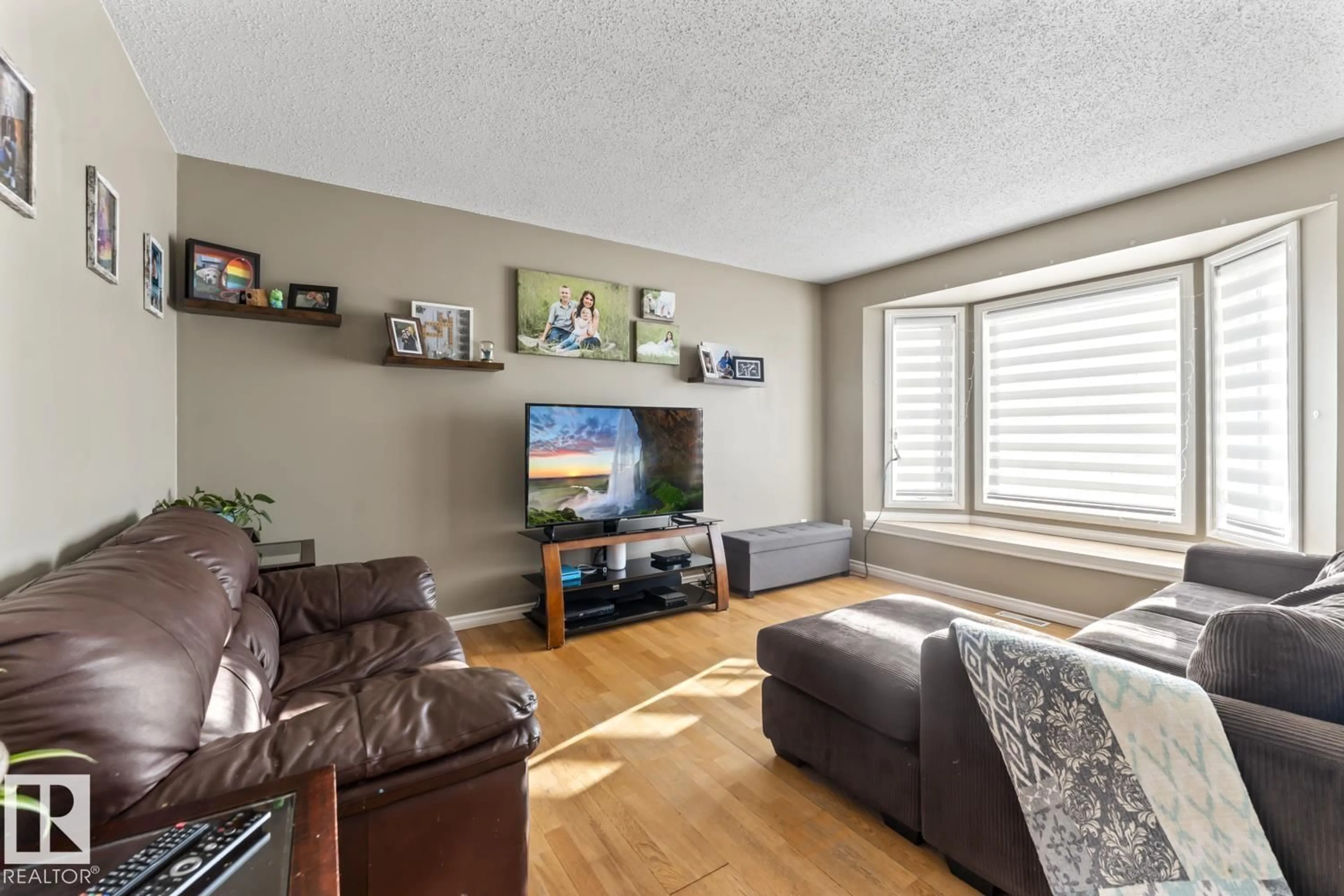 Living room with furniture, wood/laminate floor for 4514 49 AV, Cold Lake Alberta T9M1Z6