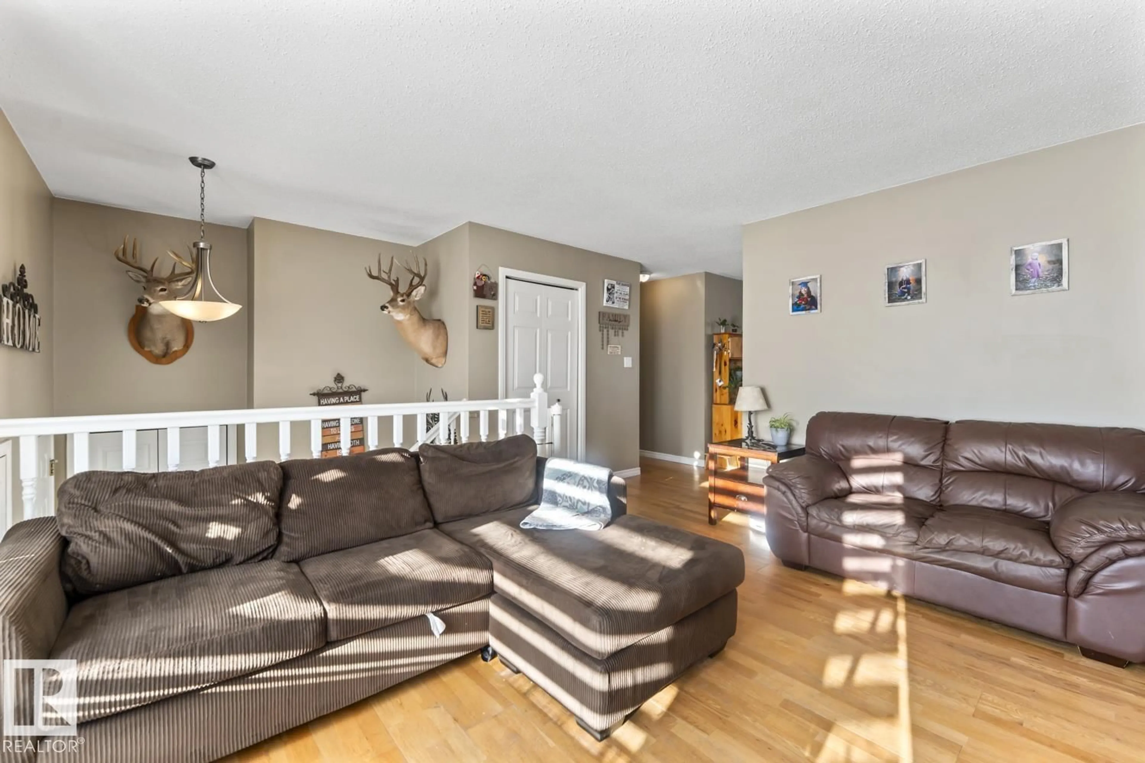 Living room with furniture, wood/laminate floor for 4514 49 AV, Cold Lake Alberta T9M1Z6