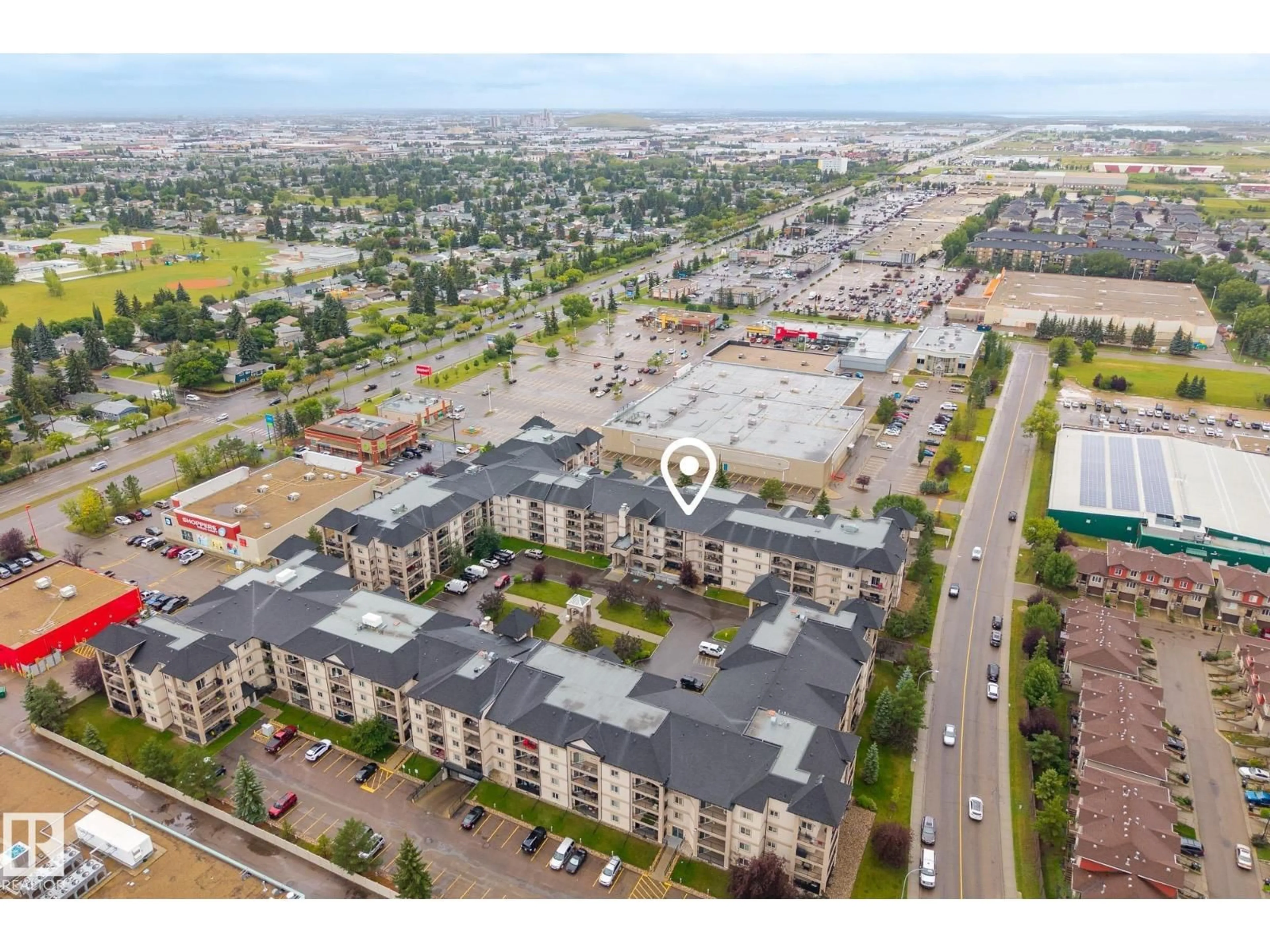 A pic from outside/outdoor area/front of a property/back of a property/a pic from drone, street for #202 - 13111 140 AV, Edmonton Alberta T6V0B1