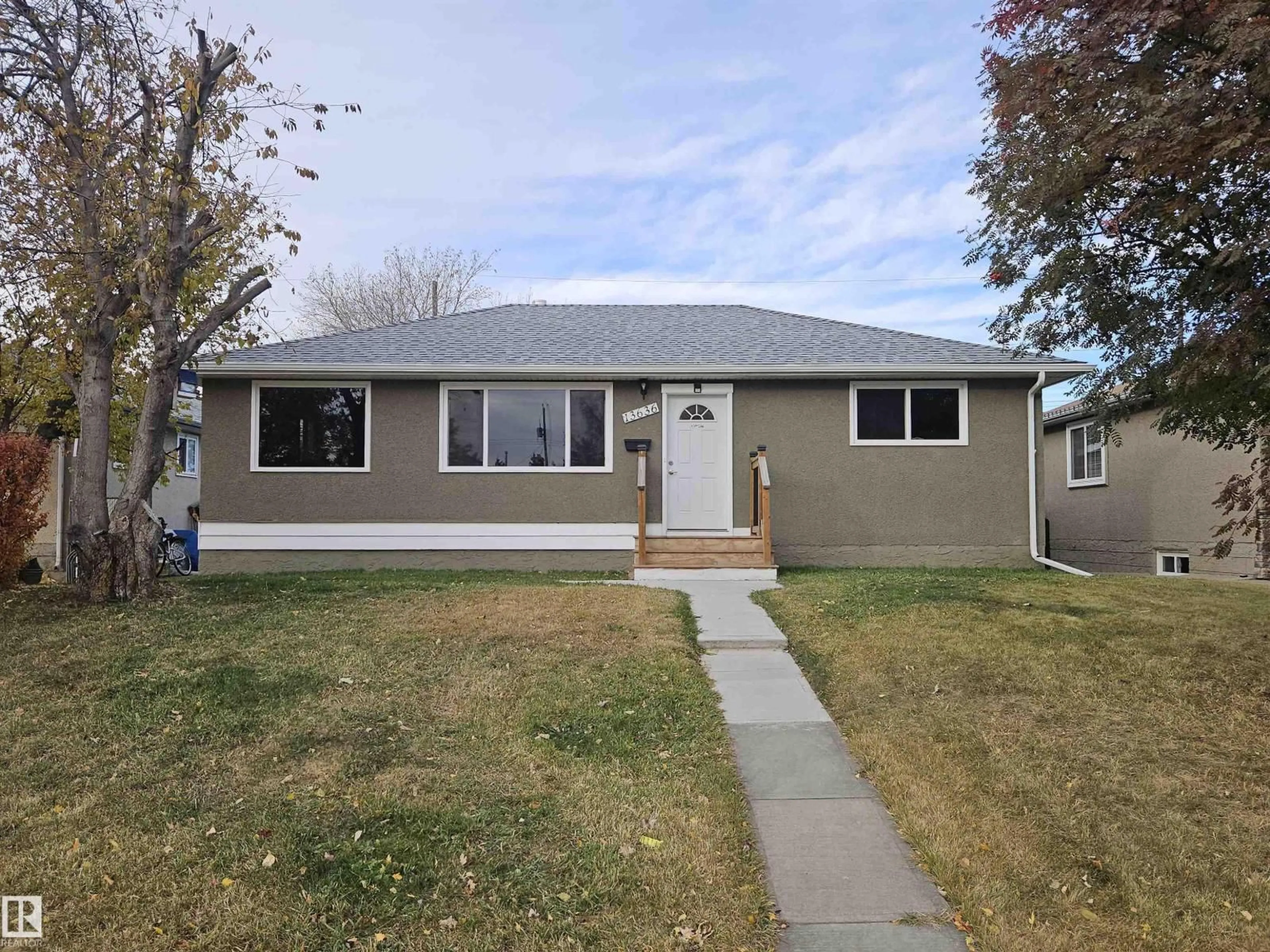 Home with vinyl exterior material, street for 13636 135A AV, Edmonton Alberta T5L3Z9
