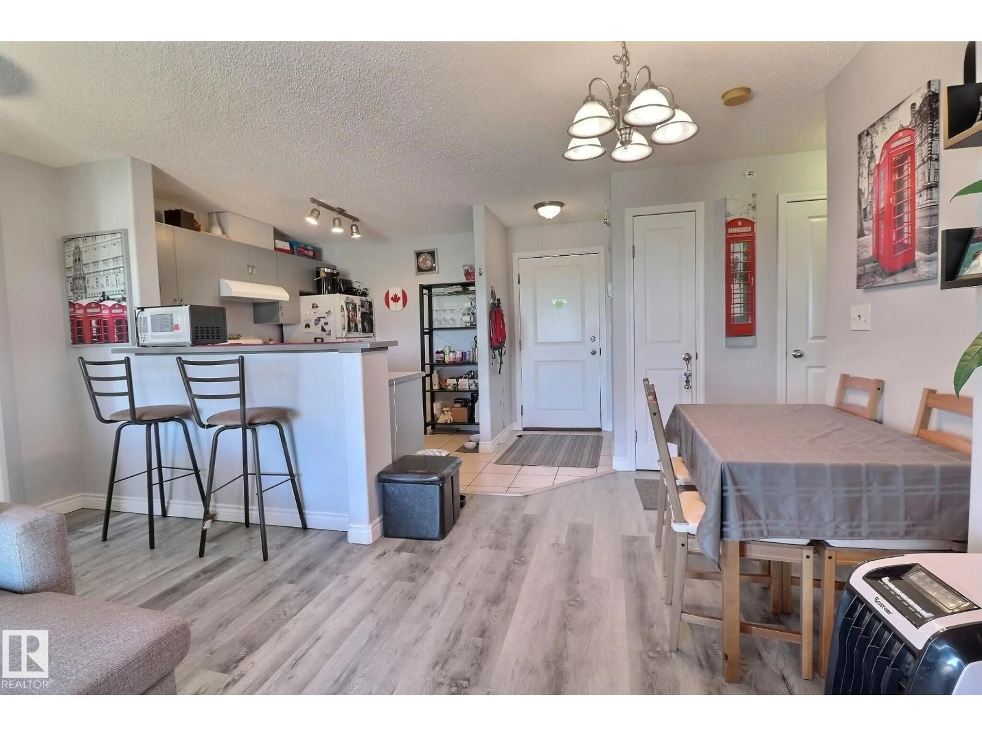 Open concept kitchen, wood/laminate floor for #416 - 14708 50 ST, Edmonton Alberta T5A5B7