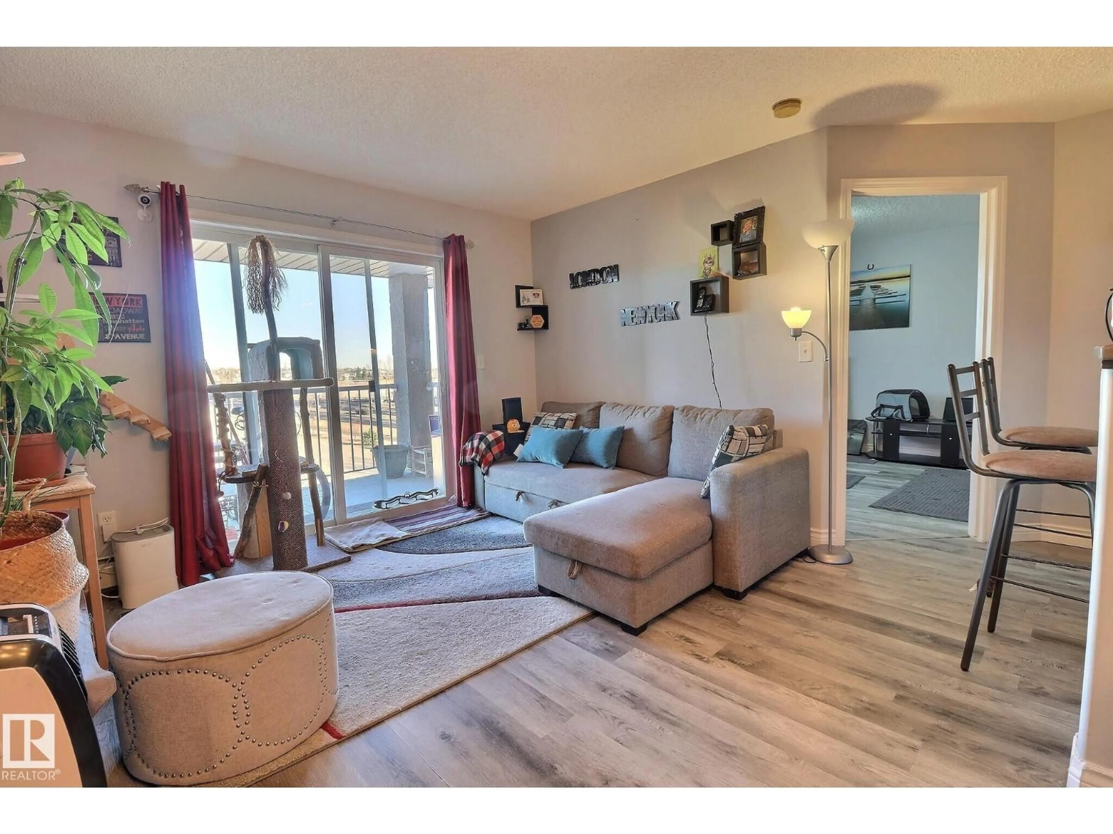 Living room with furniture, wood/laminate floor for #416 - 14708 50 ST, Edmonton Alberta T5A5B7