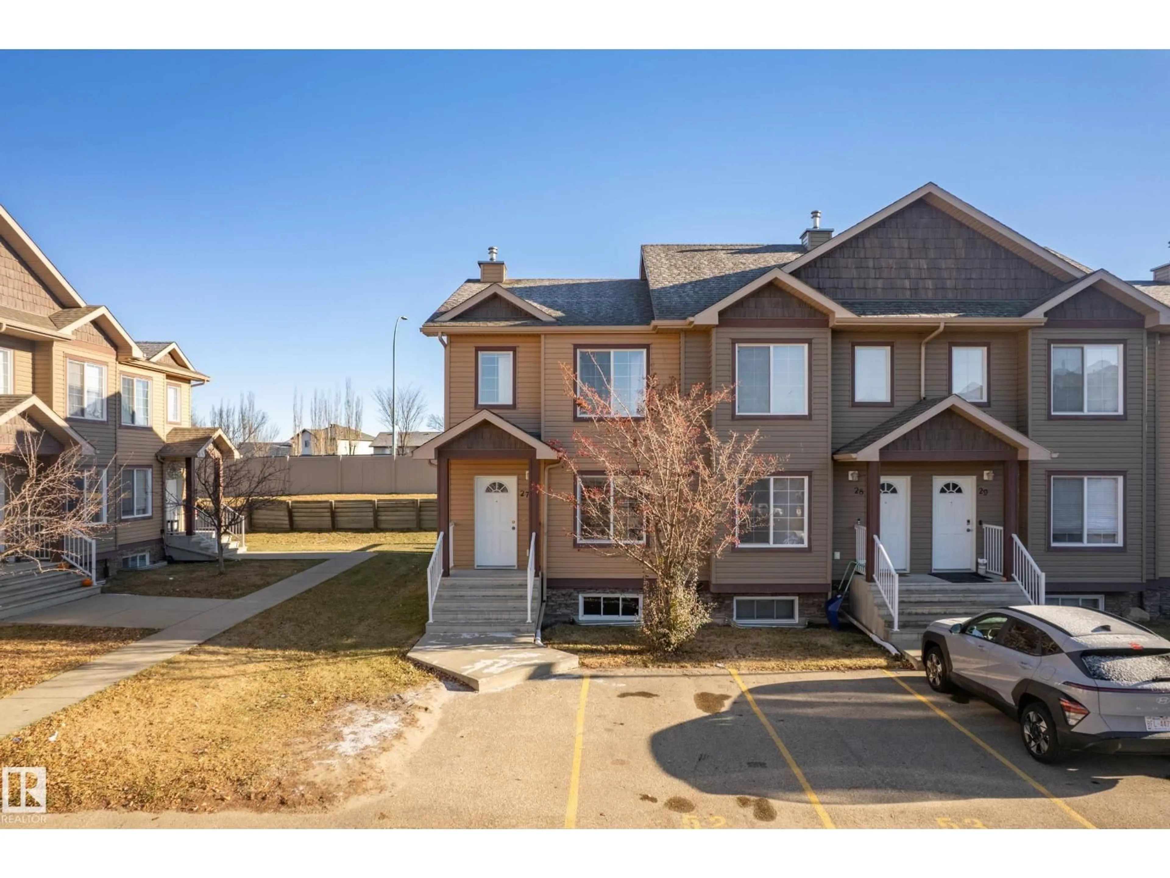 A pic from outside/outdoor area/front of a property/back of a property/a pic from drone, street for 320 - 27 SPRUCE RIDGE RD, Spruce Grove Alberta T7X0H5
