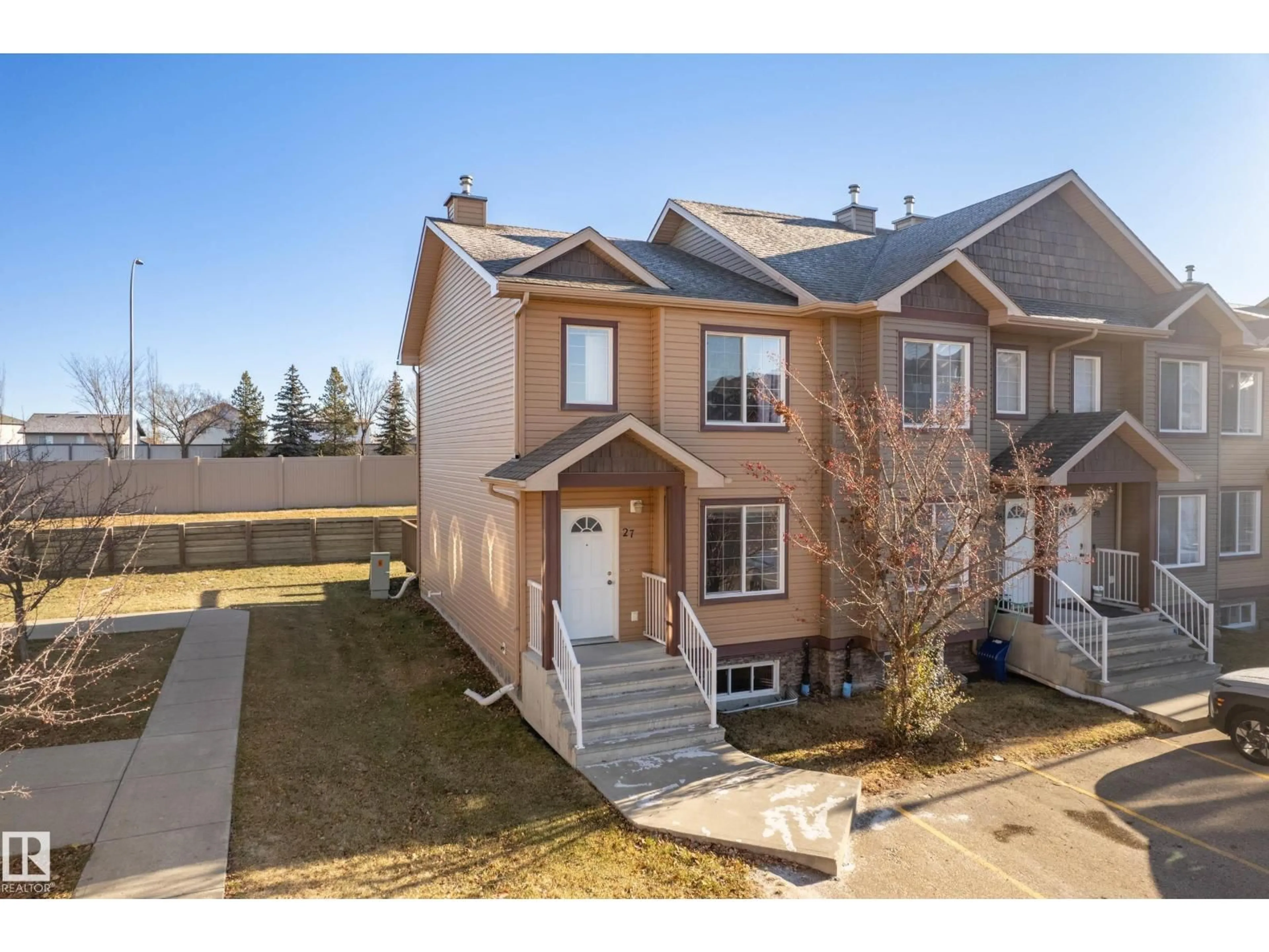 A pic from outside/outdoor area/front of a property/back of a property/a pic from drone, street for 320 - 27 SPRUCE RIDGE RD, Spruce Grove Alberta T7X0H5