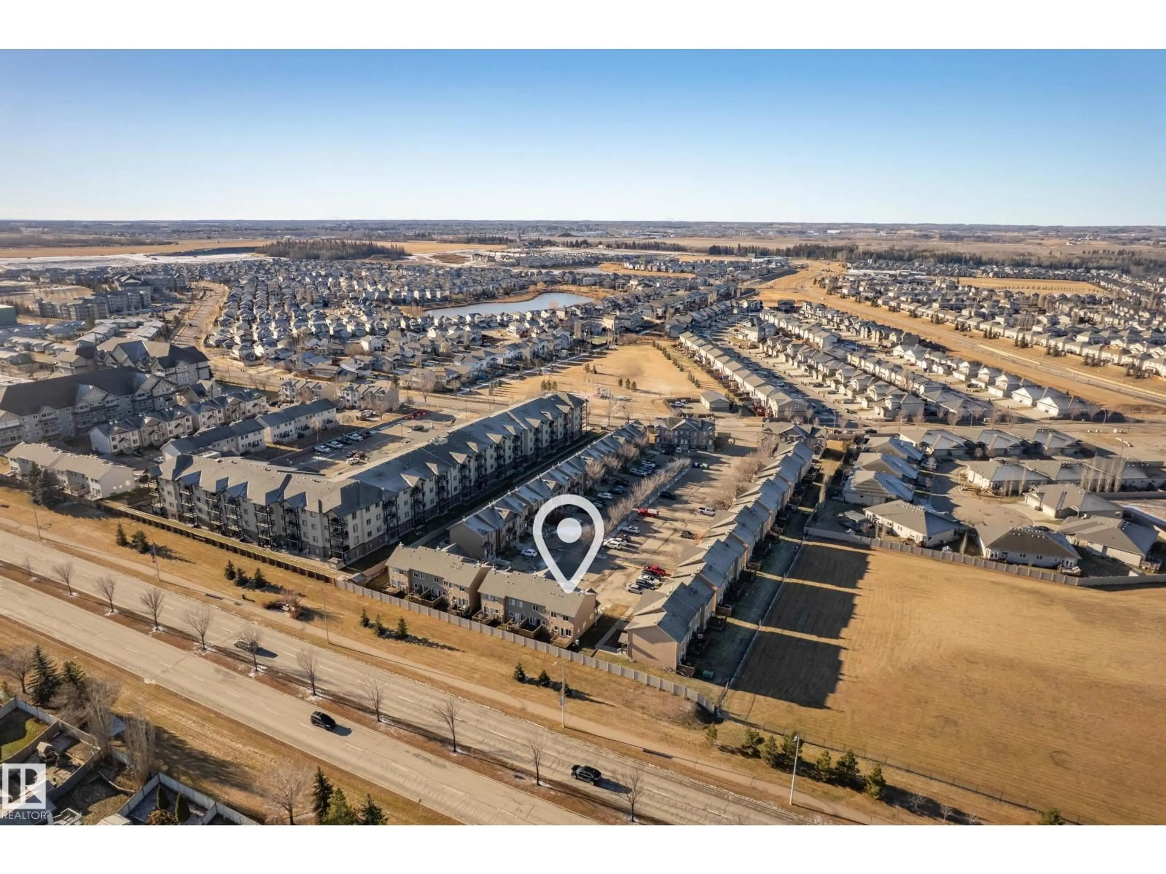 A pic from outside/outdoor area/front of a property/back of a property/a pic from drone, street for 320 - 27 SPRUCE RIDGE RD, Spruce Grove Alberta T7X0H5