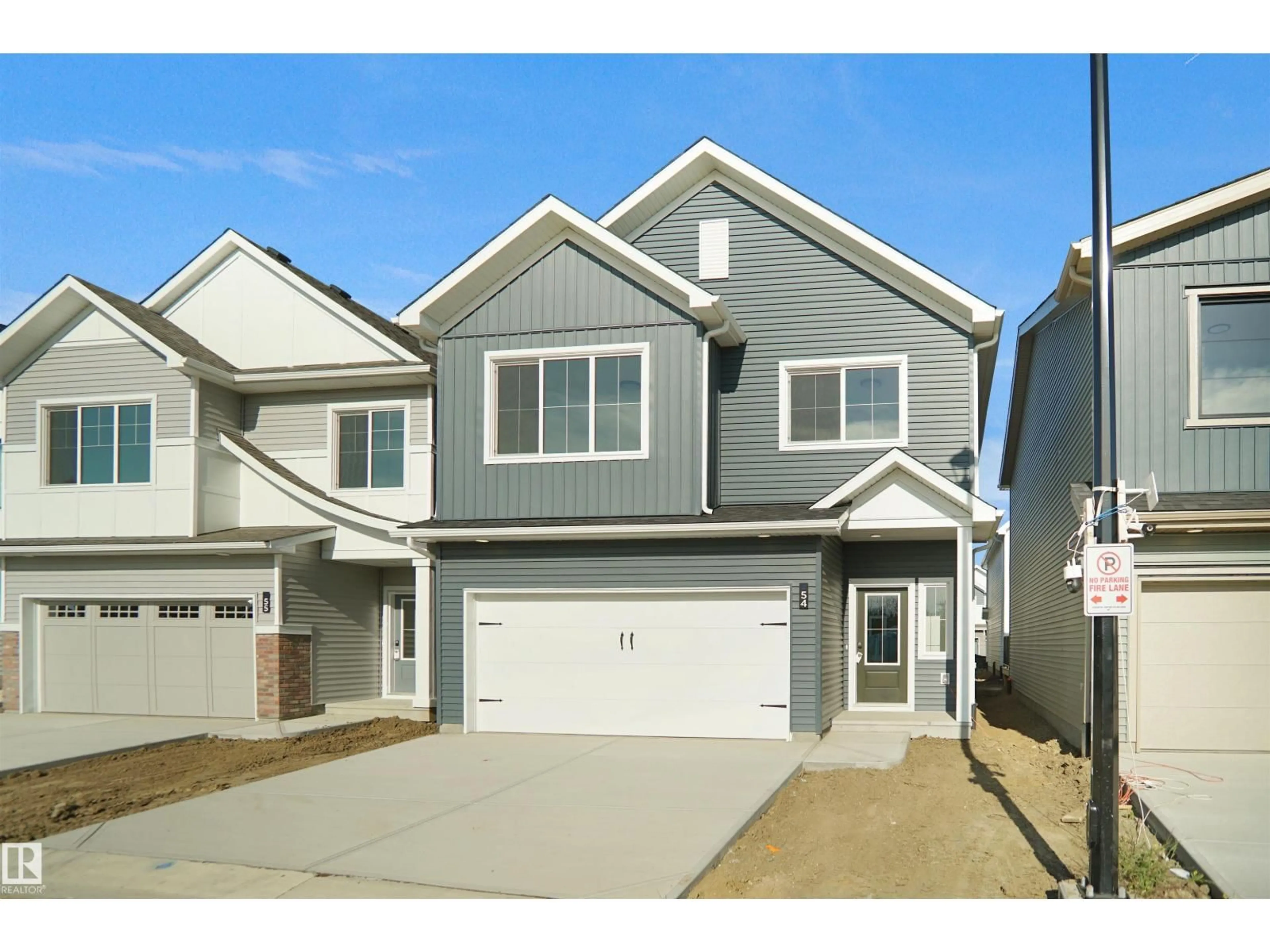 Home with vinyl exterior material, street for 54 19904 31 AV NW, Edmonton Alberta T6M1N7