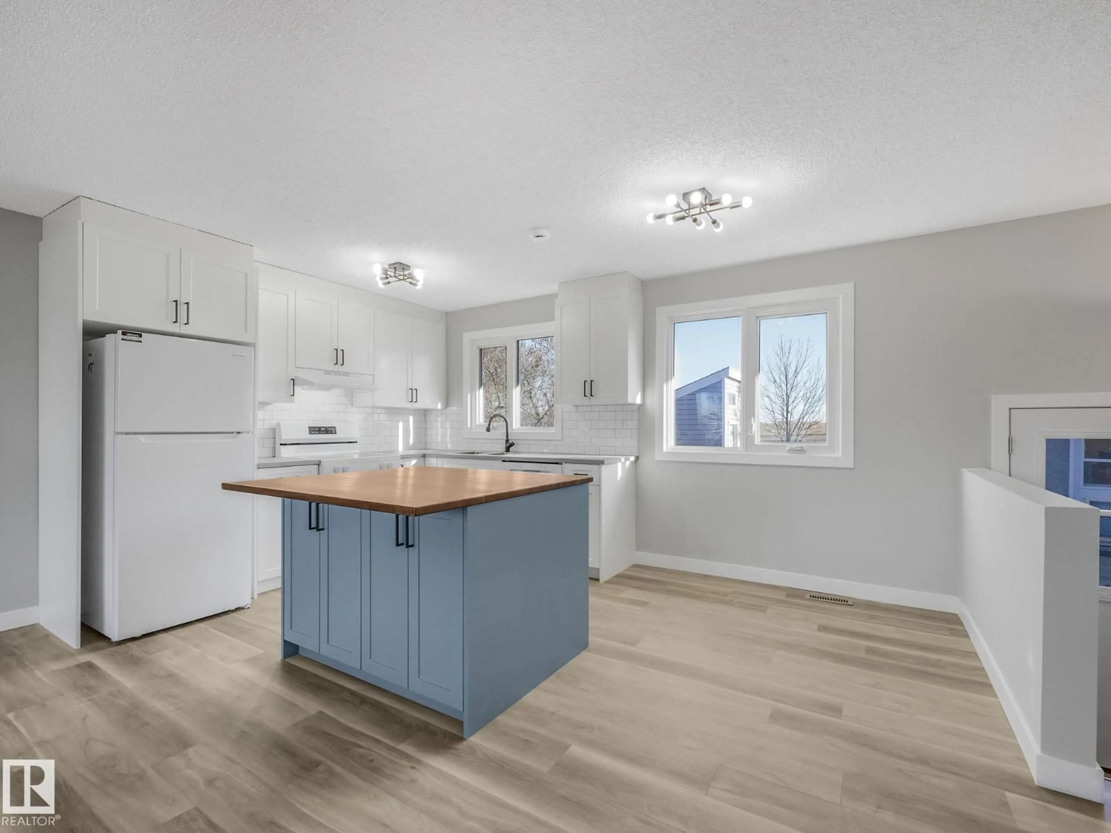 Open concept kitchen, wood/laminate floor for 8905 92 AV, Fort Saskatchewan Alberta T8L1A3