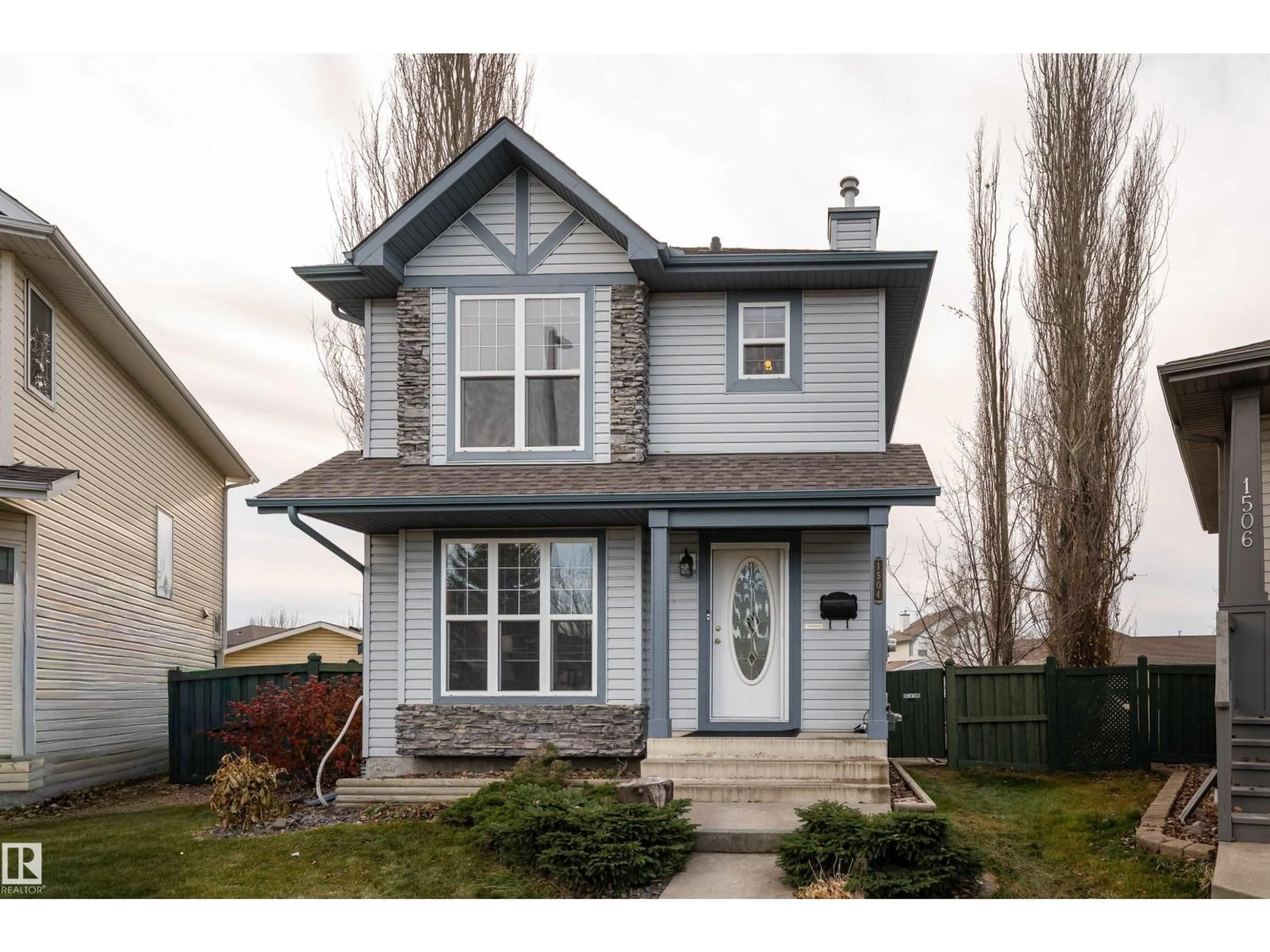 Home with vinyl exterior material, street for 1504 GRANT CO, Edmonton Alberta T5T6L3