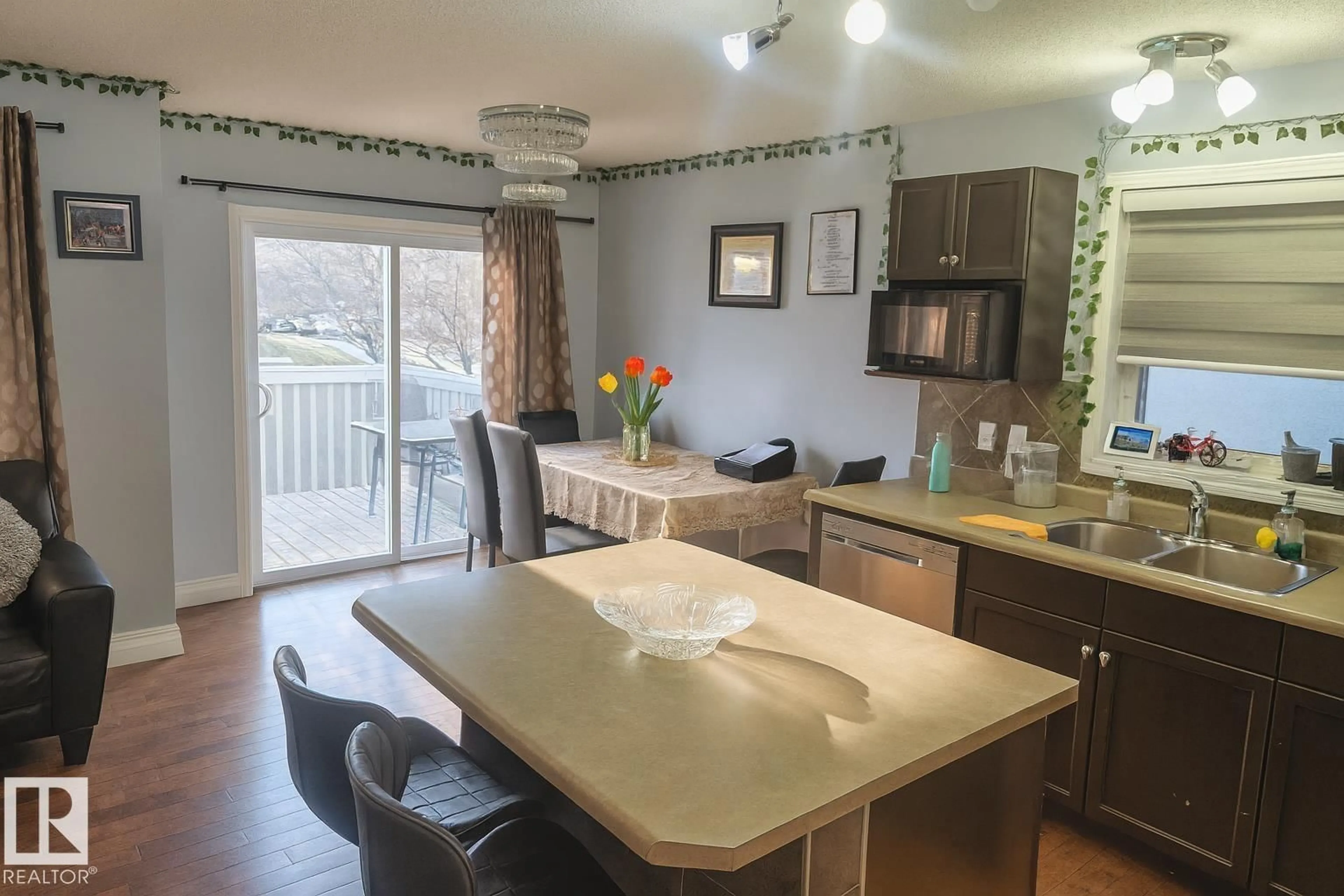 Open concept kitchen, wood/laminate floor for #4 - 4350 23 ST, Edmonton Alberta T6T1X8