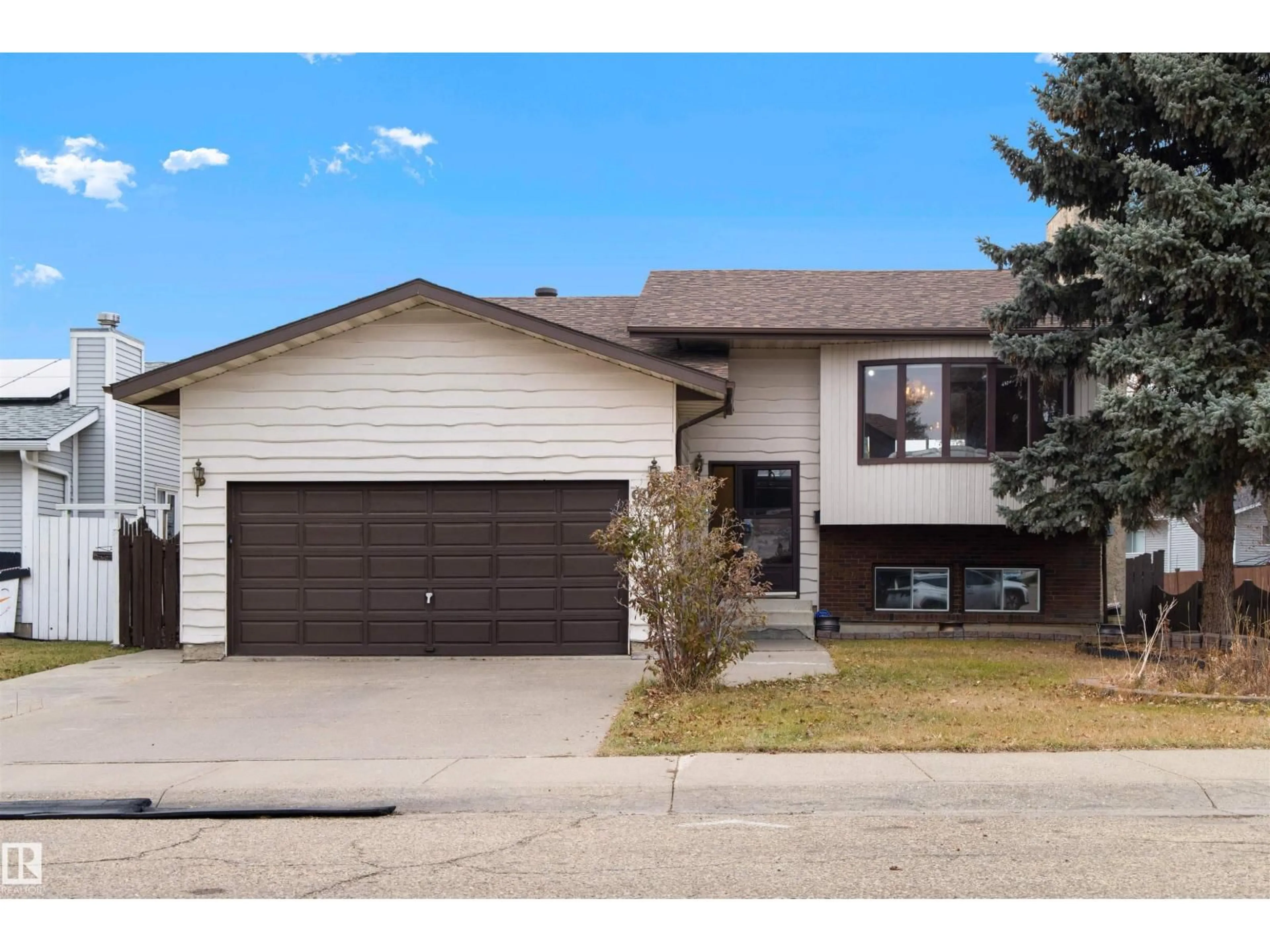 Home with vinyl exterior material, street for NW - 9920 184 ST, Edmonton Alberta T5T4E1