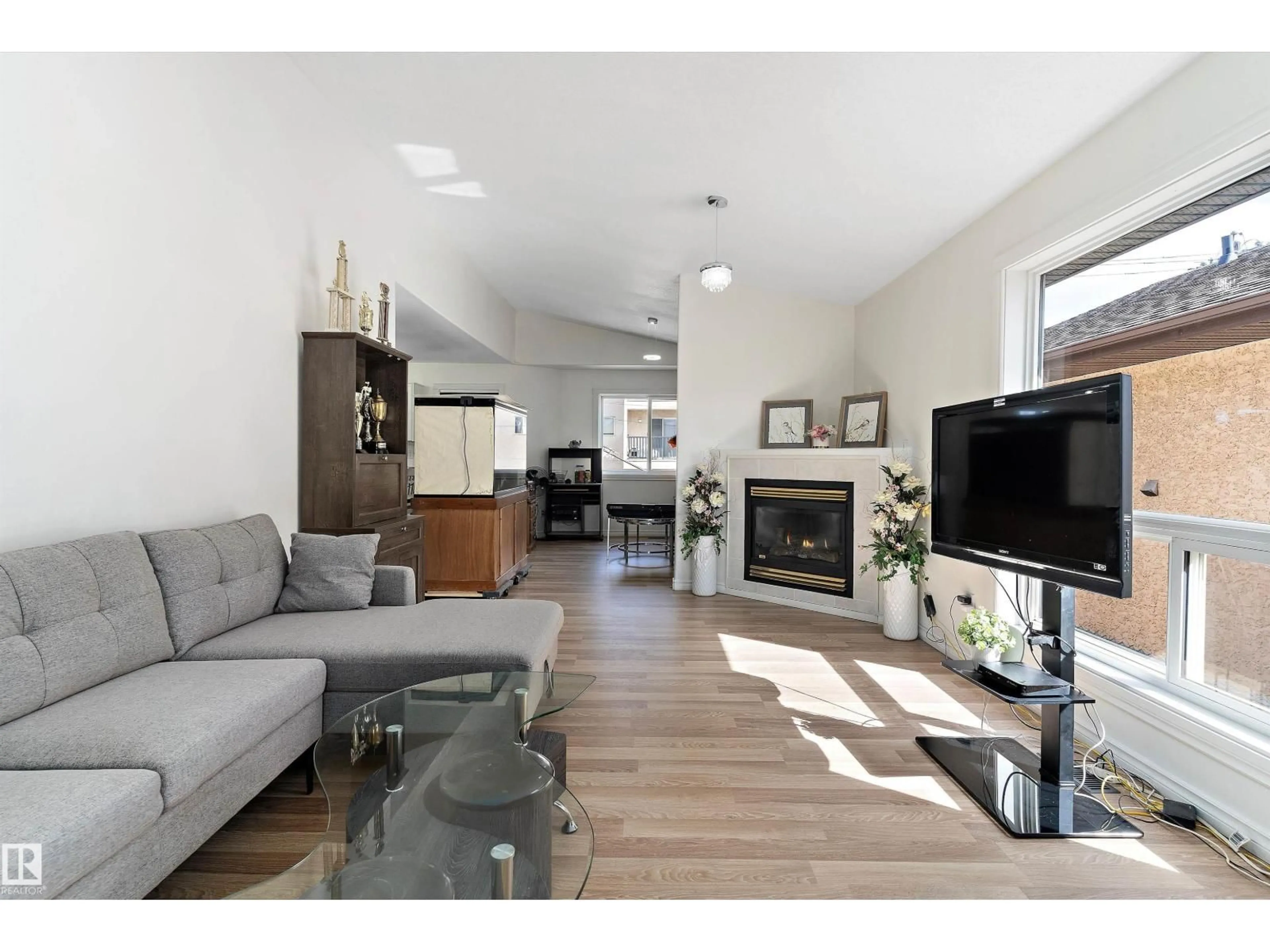 Living room with furniture, wood/laminate floor for NW - 12711 128 ST, Edmonton Alberta T5L1E2