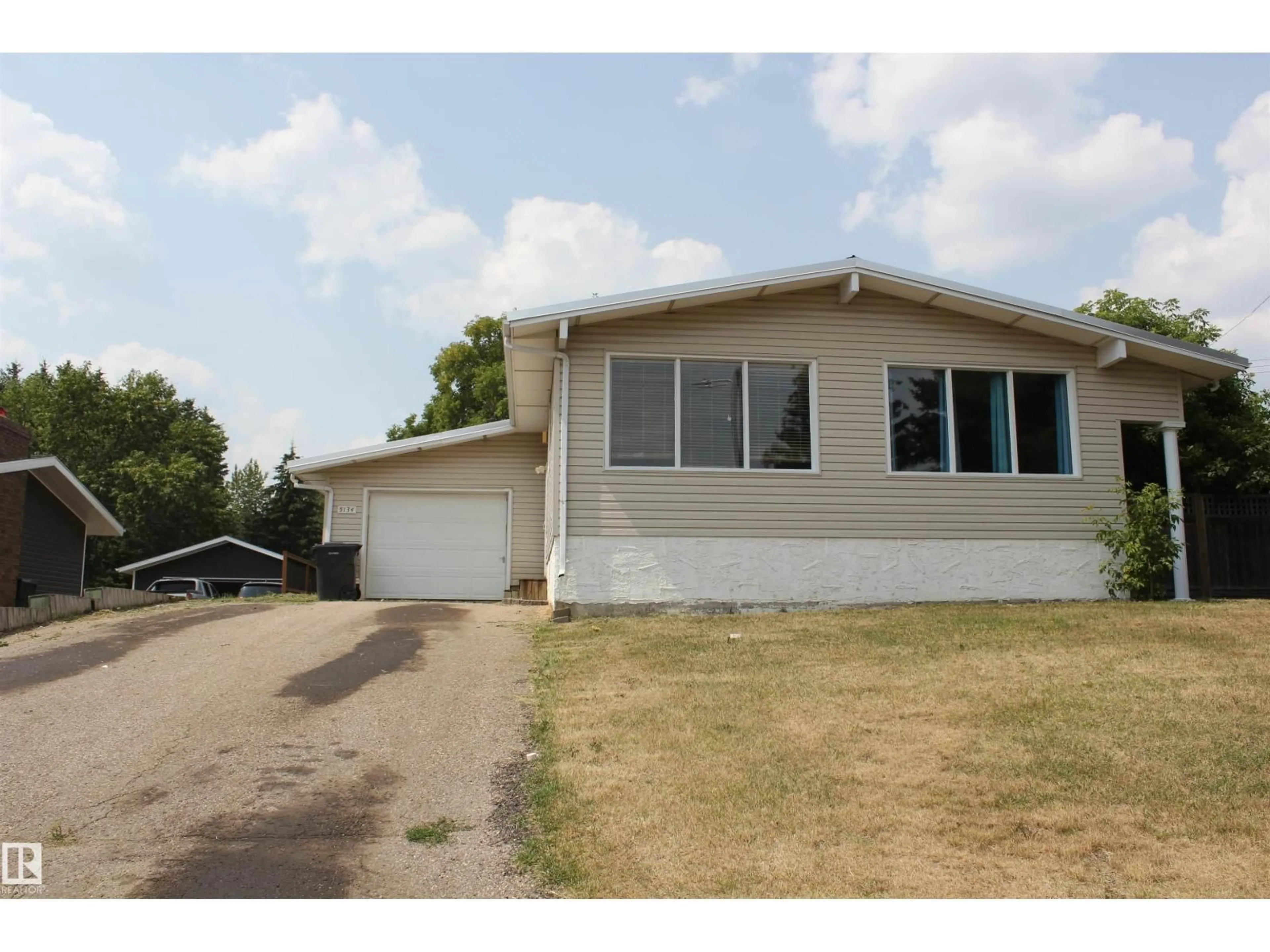 Home with vinyl exterior material, street for 5134 56A AV, Elk Point Alberta T0A1A0