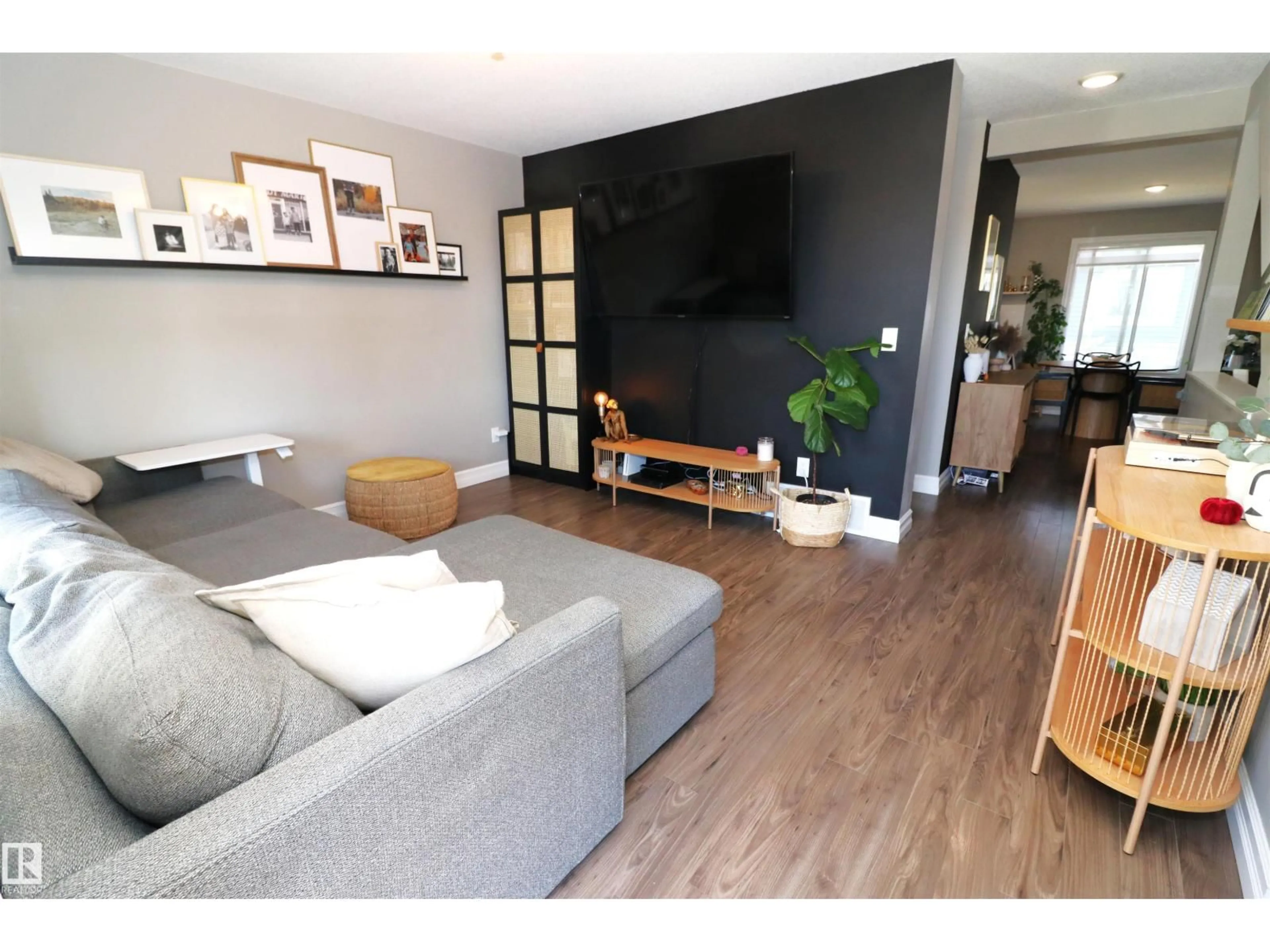 Living room with furniture, wood/laminate floor for 1508 105 ST, Edmonton Alberta T6J5R8