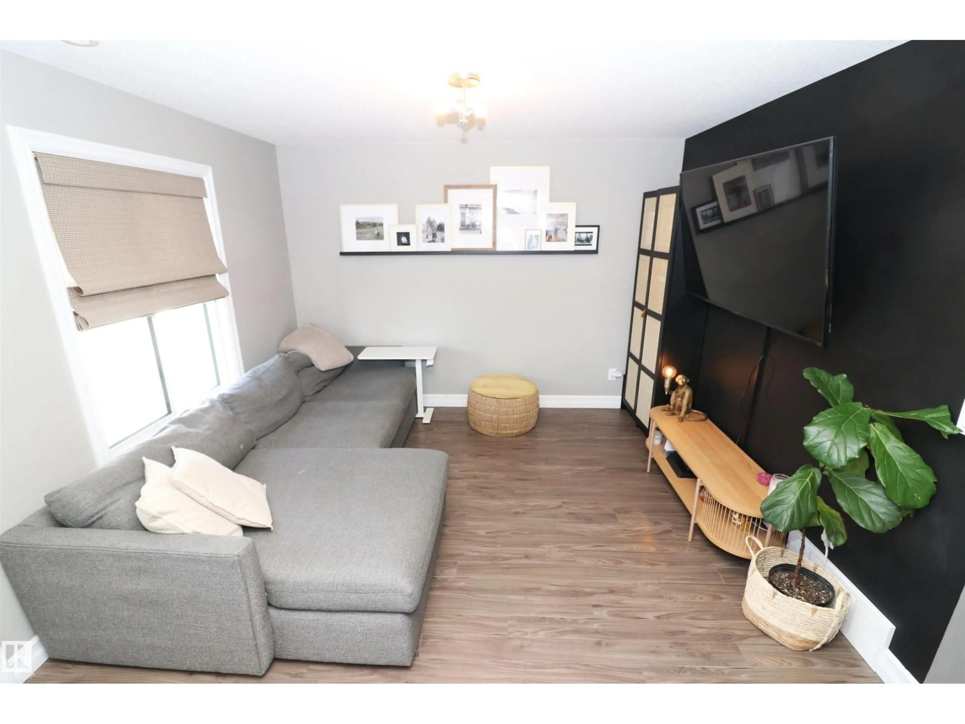 Living room with furniture, wood/laminate floor for 1508 105 ST, Edmonton Alberta T6J5R8