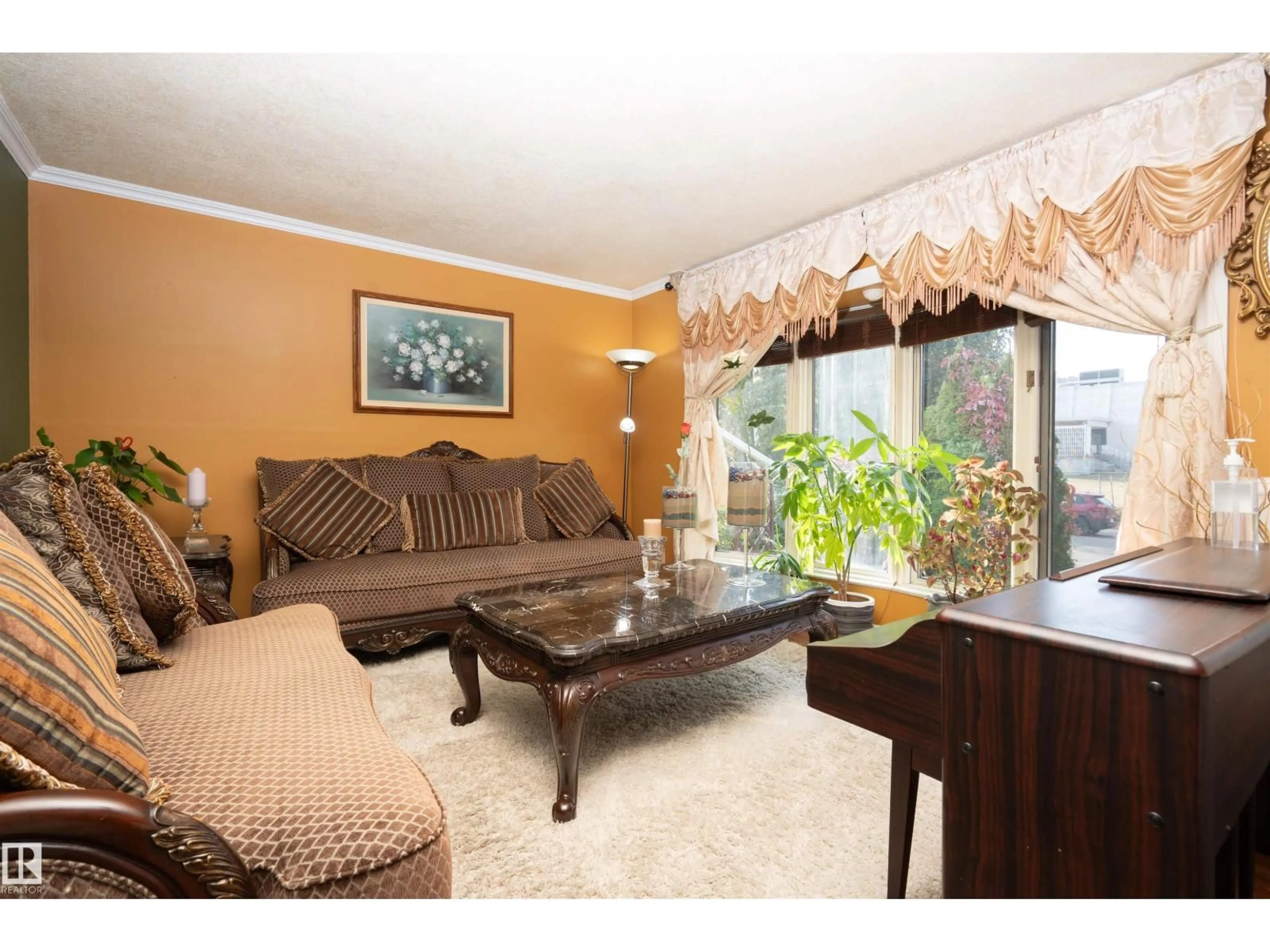 Living room with furniture, wood/laminate floor for 8721 152 ST, Edmonton Alberta T5R1L9