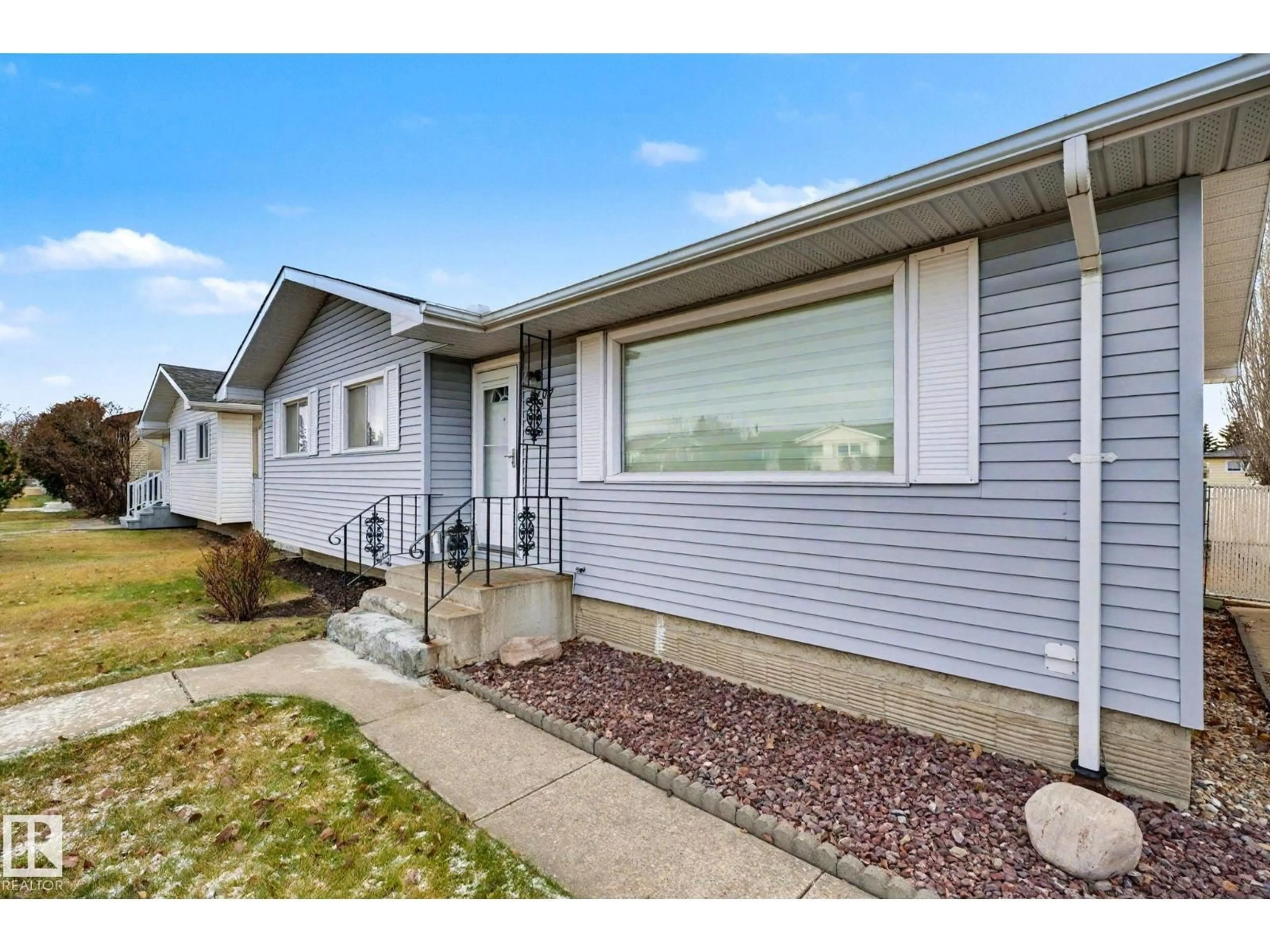 Home with vinyl exterior material, street for 8407 149A AV, Edmonton Alberta T5E2M9